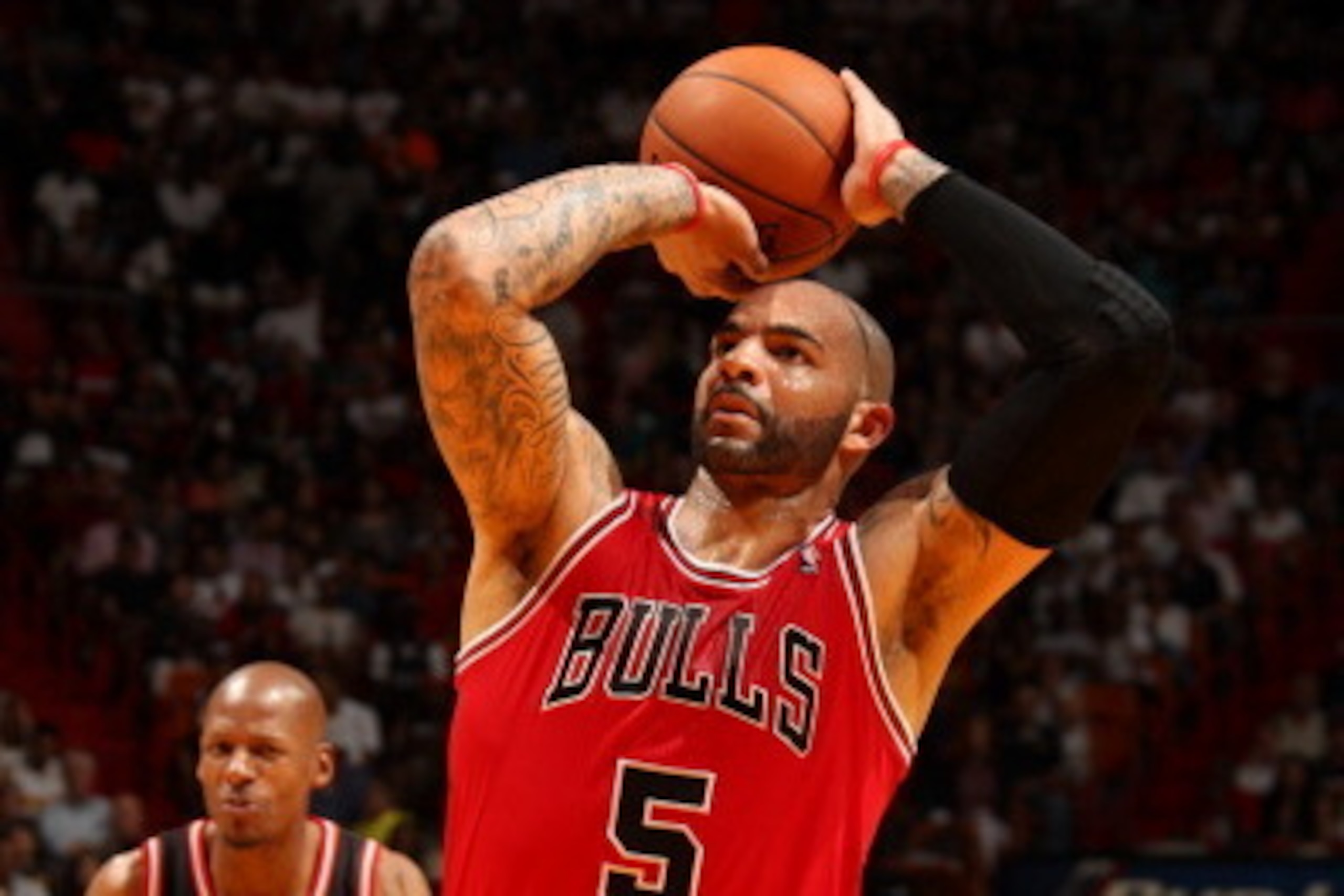 MIAMI, FL - February 23: Carlos Boozer #5 of the Chicago Bulls shoots the ball against the Miami Heat at the American Airlines Arena in Miami, Florida on Feb. 3, 2014. NOTE TO USER: User expressly acknowledges and agrees that, by downloading and/or using MIAMI, FL - February 23: Carlos Boozer #5 of the Chicago Bulls shoots the ball against the Miami Heat at the American Airlines Arena in Miami, Florida on Feb. 3, 2014. NOTE TO USER: User expressly acknowledges and agrees that, by downloading and/or using