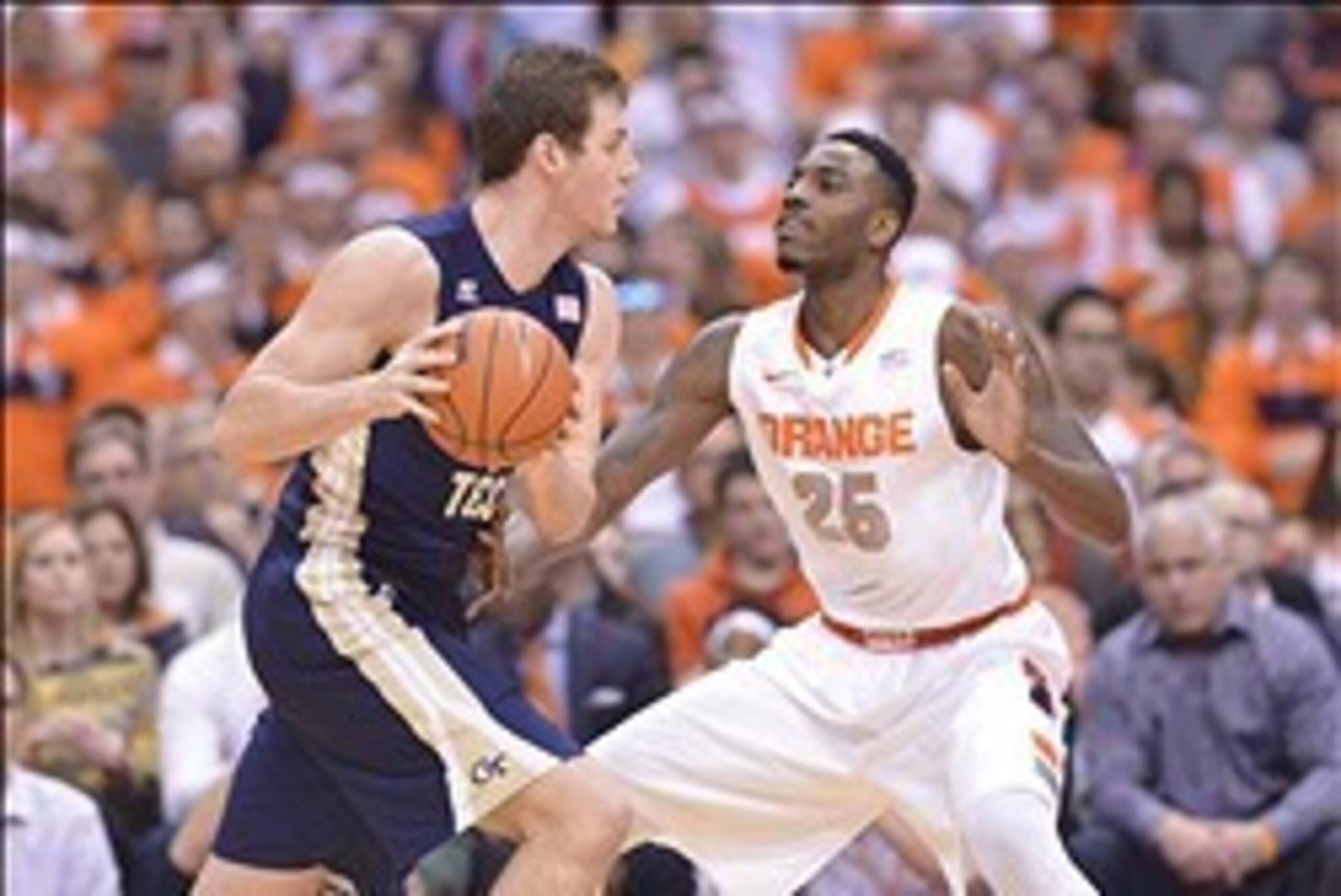Mar 4, 2014; Syracuse, NY, USA; Syracuse Orange forward Rakeem Christmas (25) defends against Georgia Tech Yellow Jackets center Daniel Miller (5) during the first half of a game at the Carrier Dome. Mandatory Credit: Mark Konezny-USA TODAY Sports Mar 4, 2014; Syracuse, NY, USA; Syracuse Orange forward Rakeem Christmas (25) defends against Georgia Tech Yellow Jackets center Daniel Miller (5) during the first half of a game at the Carrier Dome. Mandatory Credit: Mark Konezny-USA TODAY Sports
