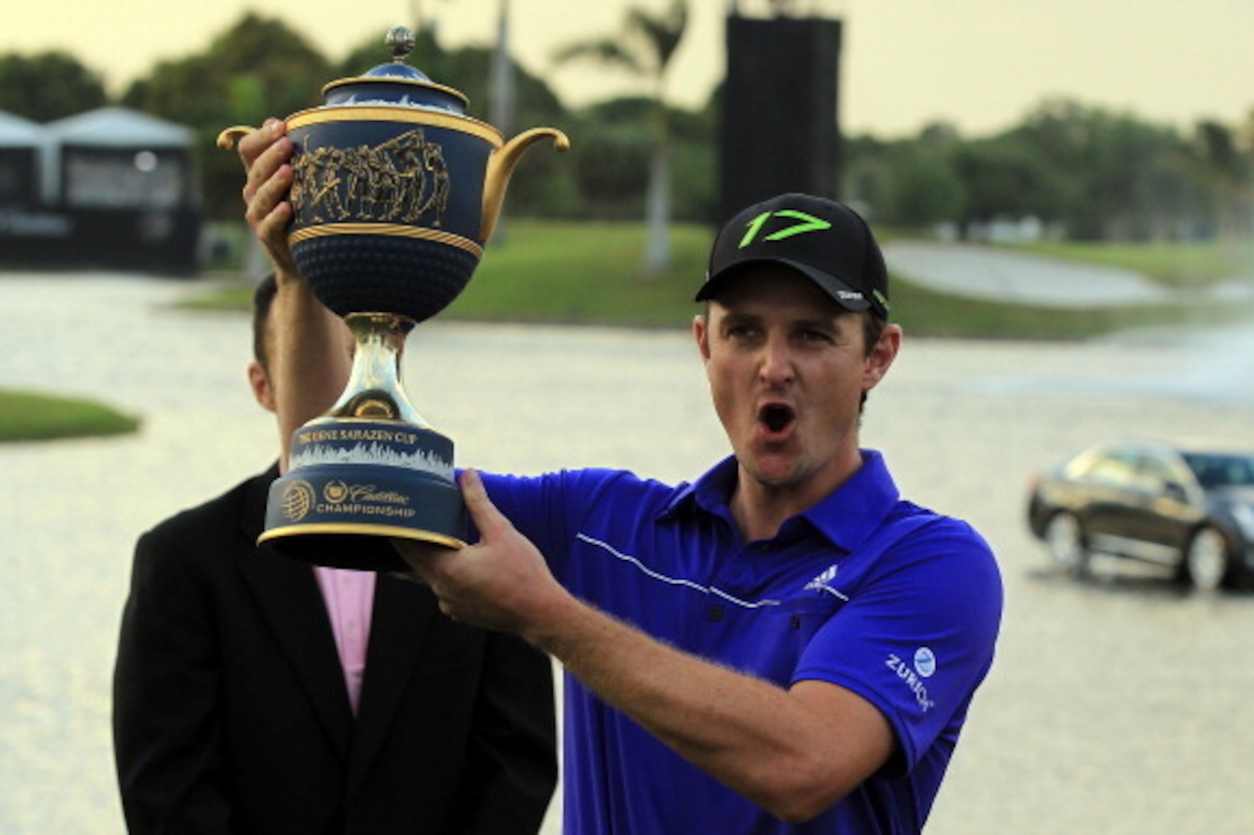 MIAMI, FL - MARCH 11:  Justin Rose of England holds the Gene Sarazen Cup awarded to the winner after the final round of the World Golf Championship Cadillac Championship on the TPC Blue Monster Course at Doral Golf Resort And Spa on March 11, 2012 in Miam