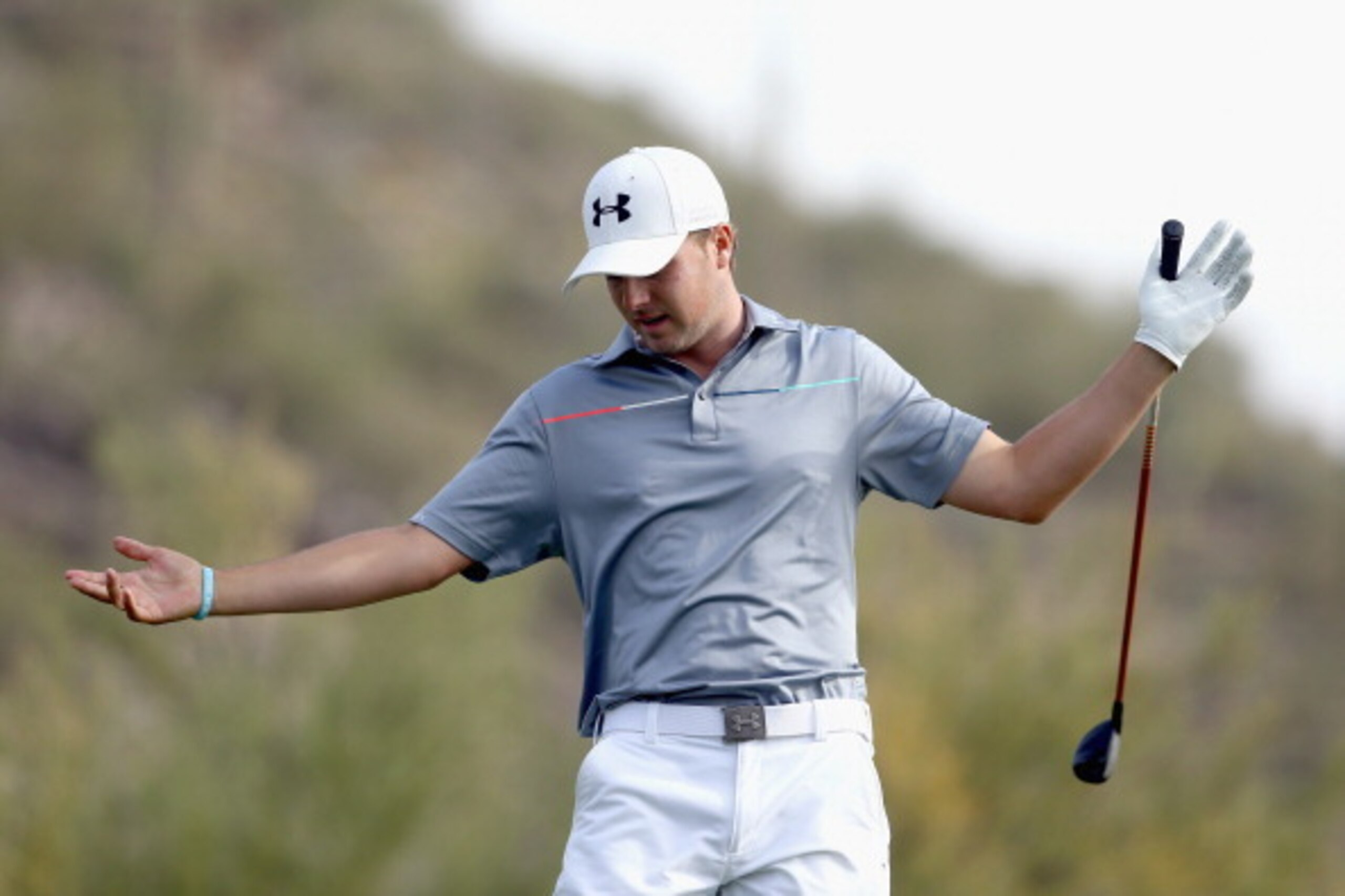 MARANA, AZ - FEBRUARY 22:  Jordan Spieth reacts after his tee shot on the 16th hole during the quarterfinal round of the World Golf Championships - Accenture Match Play Championship at The Golf Club at Dove Mountain on February 22, 2014 in Marana, Arizona