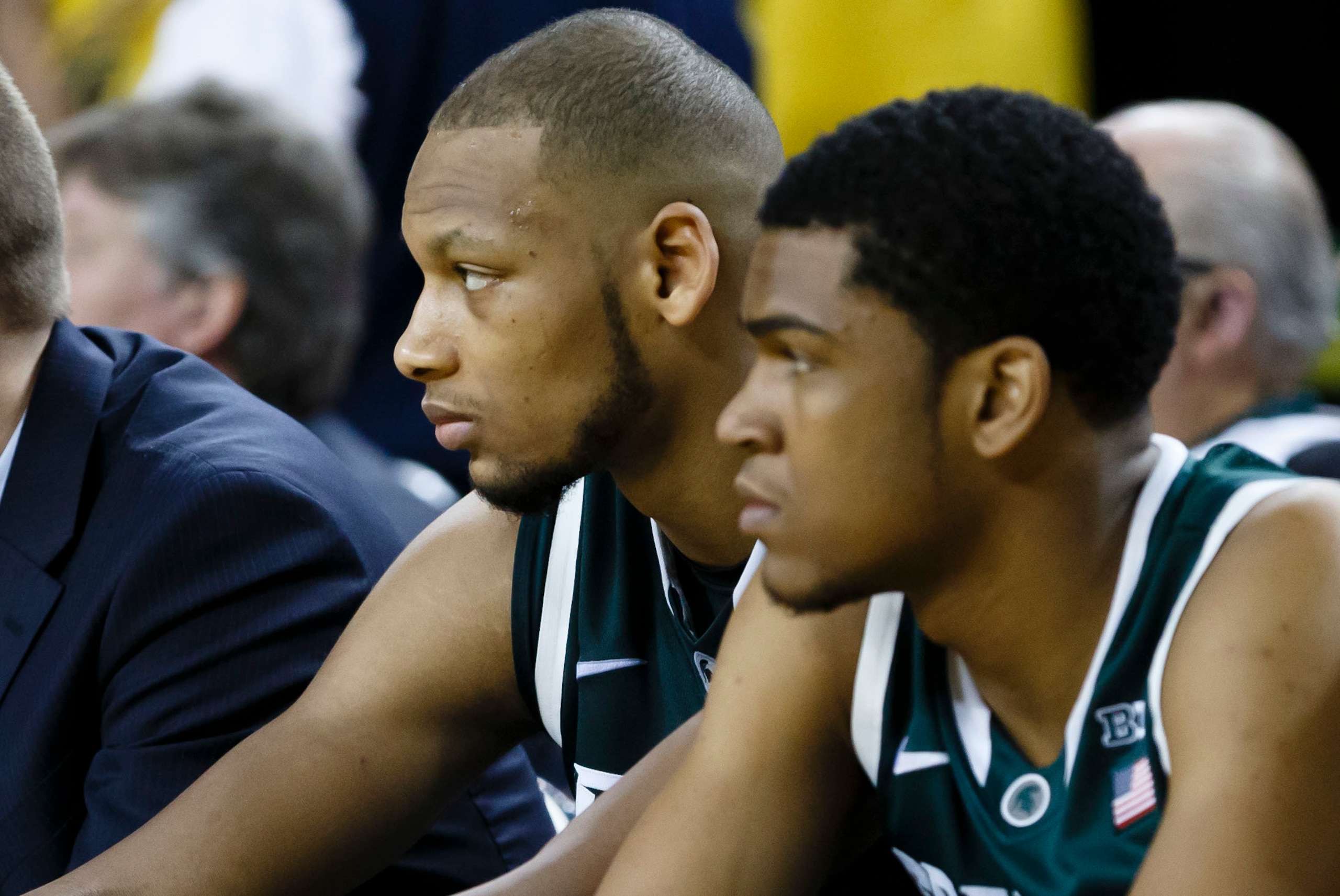 Feb 23, 2014; Ann Arbor, MI, USA; Michigan State Spartans forward Adreian Payne (left) and guard Alvin Ellis III (right) sits on the bench in the second half against the Michigan Wolverines at Crisler Arena. Michigan 79-70. Mandatory Credit: Rick Osentosk