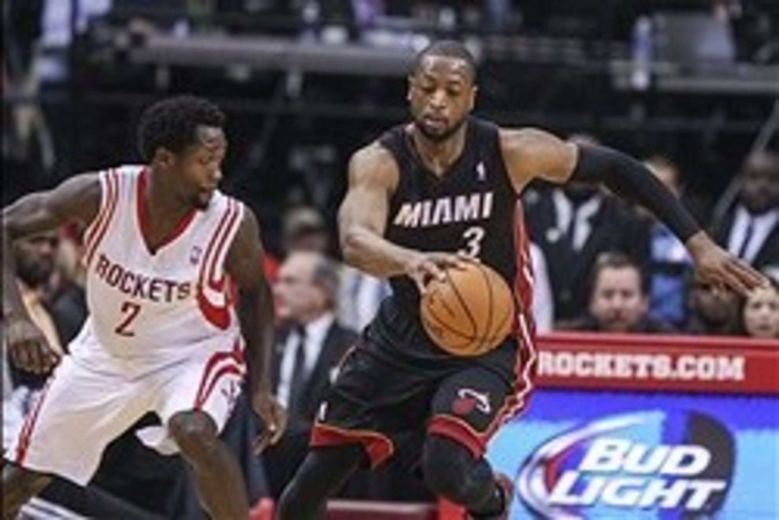 Mar 4, 2014; Houston, TX, USA; Miami Heat shooting guard Dwyane Wade (3) controls the ball during the second quarter as Houston Rockets point guard Patrick Beverley (2) defends at Toyota Center. Mandatory Credit: Troy Taormina-USA TODAY Sports