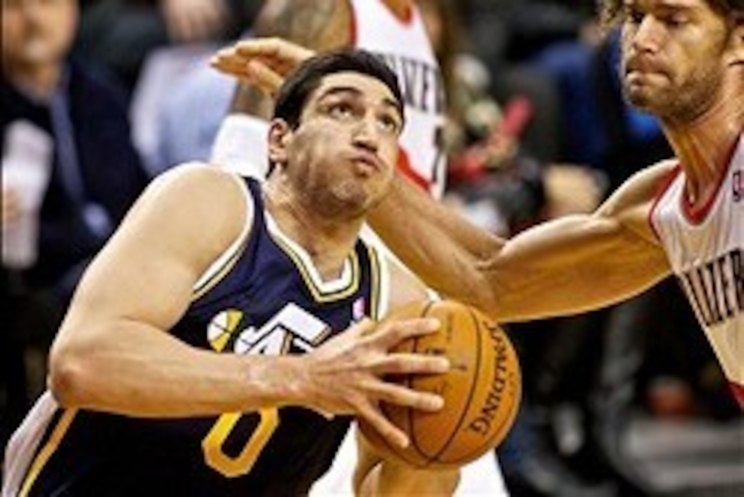 Feb 21, 2014; Portland, OR, USA; Utah Jazz center Enes Kanter (0) drives past Portland Trail Blazers center Robin Lopez (42) during the fourth quarter at the Moda Center. Mandatory Credit: Craig Mitchelldyer-USA TODAY Sports