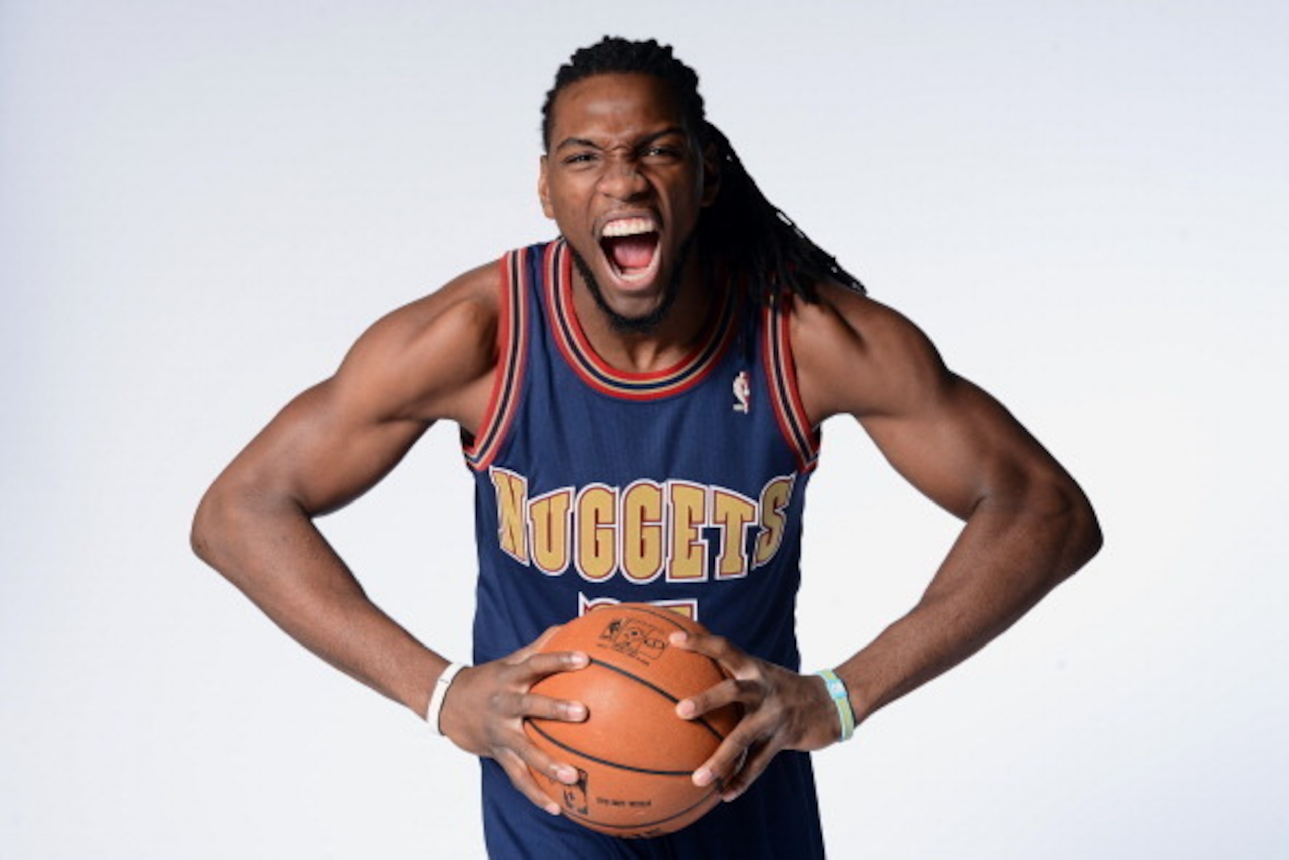 DENVER, CO - MARCH 4: Kenneth Faried #35 of the Denver Nuggets poses for photos wearing the uniform from the 1993-1994 season on March 4, 2014 at the Pepsi Center in Denver, Colorado. NOTE TO USER: User expressly acknowledges and agrees that, by downloadi DENVER, CO - MARCH 4: Kenneth Faried #35 of the Denver Nuggets poses for photos wearing the uniform from the 1993-1994 season on March 4, 2014 at the Pepsi Center in Denver, Colorado. NOTE TO USER: User expressly acknowledges and agrees that, by downloadi