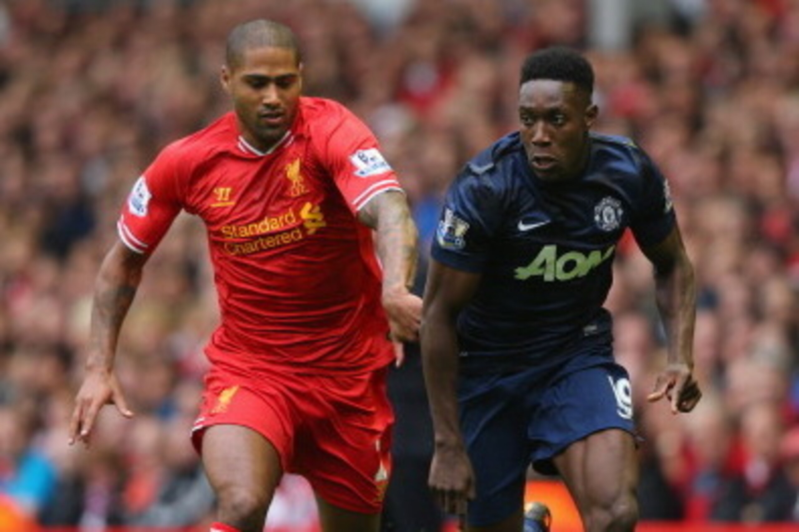 LIVERPOOL, ENGLAND - SEPTEMBER 01:  Glen Johnson of Liverpool competes with Danny Welbeck of Manchester United during the Barclays Premier League match between Liverpool and Manchester United at Anfield on September 01, 2013 in Liverpool, England.  (Photo
