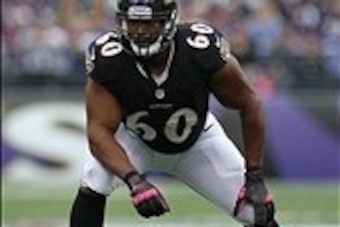 Oct 13, 2013; Baltimore, MD, USA; Baltimore Ravens tackle Eugene Monroe (60) in action against the Green Bay Packers at M&T Bank Stadium. Mandatory Credit: Mitch Stringer-USA TODAY Sports