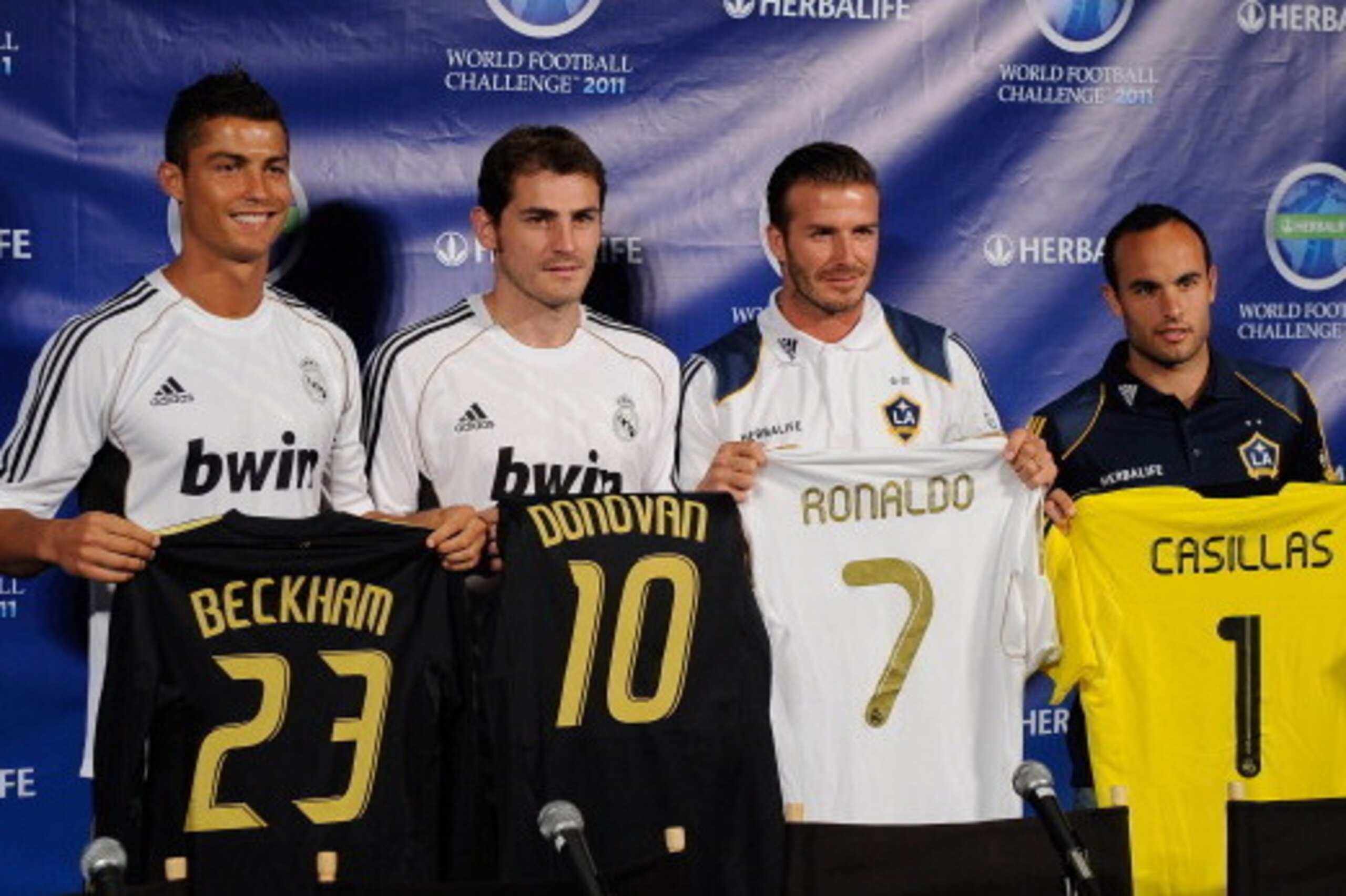 LOS ANGELES, CA - JULY 12:  Real Madrid players  Cristiano Ronaldo, (L) goalkeeper Iker Casillas (2L) and Los Angeles Galaxy players David Beckham (2R) and Landon Donovan pose after a news conference to announce the Herbalife World Football Challange 2011