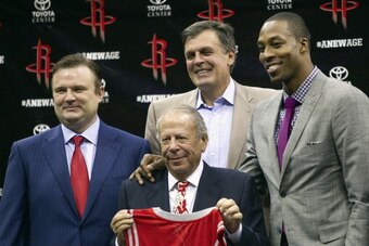 HOUSTON - JULY 13:  Dwight Howard (R) poses with Houston Rockets owner Les Alexander (2L), Houston Rockets general manager Daryl Morey (L) and Houston Rockets head coach Kevin McHale after being introduced as the newest Houston Rocket at Toyota Center on 