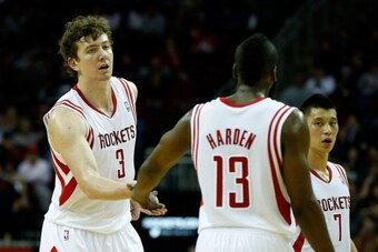 HOUSTON, TX - JANUARY 02:  Omer Asik #3 and James Harden #13 of the Houston Rockets celebrate a play against the New Orleans Hornets at Toyota Center on January 2, 2013 in Houston, Texas.  NOTE TO USER: User expressly acknowledges and agrees that, by down
