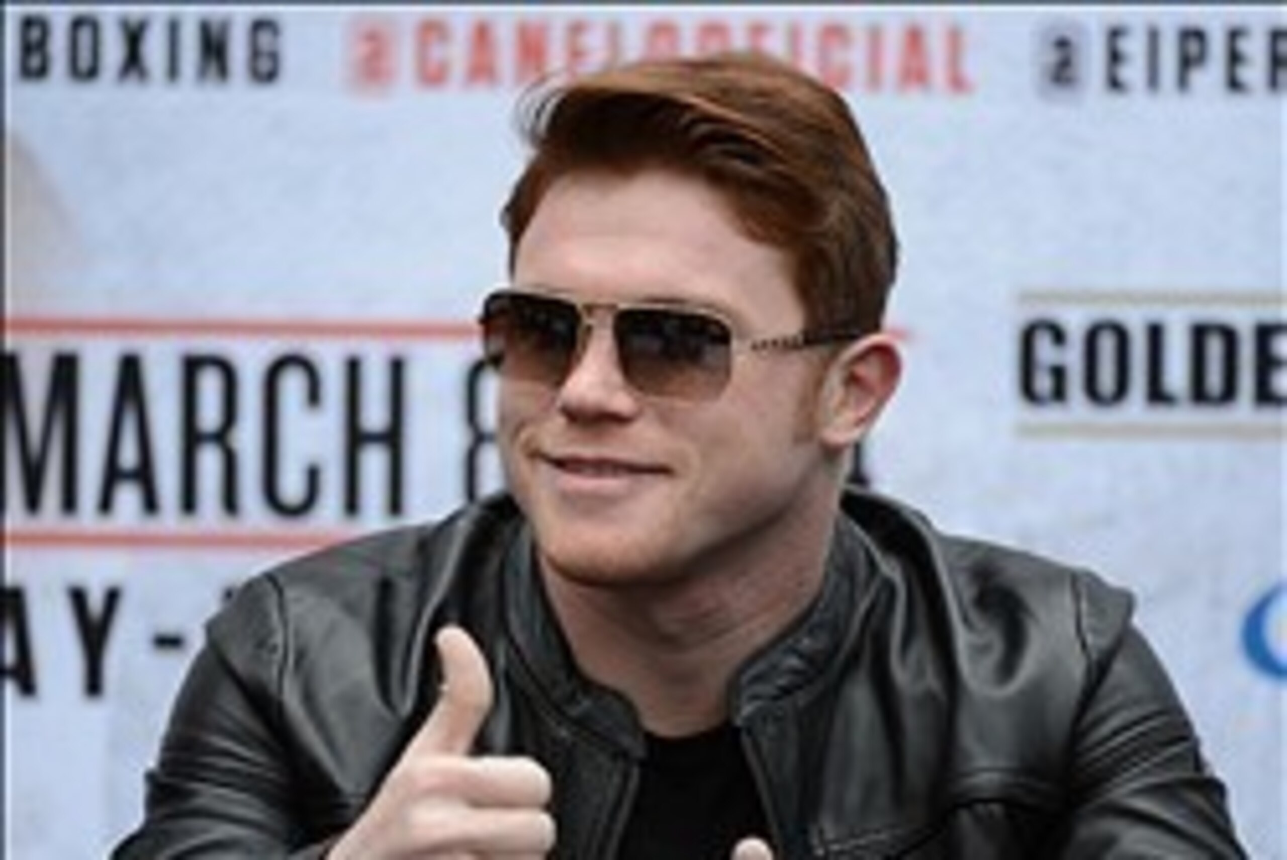 Jan 21, 2014; Los Angeles, CA, USA; Canelo Alvarez waves to his fans during a press conference held at the Los Angeles Central Public Library to announce the 12-round super welterweight bout against Alfredo Angulo on March 8, 2014 at the MGM Grand, Las Ve