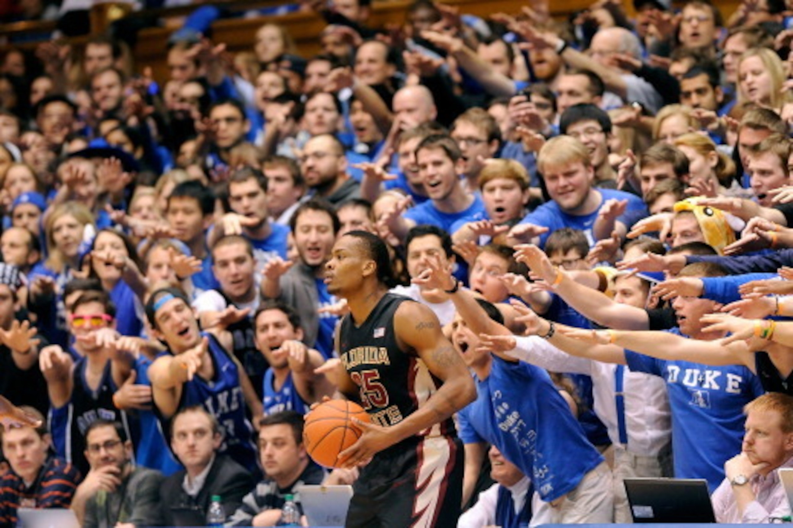 DURHAM, NC - JANUARY 25:  The Cameron Crazies taunt Aaron Thomas #25 of the Florida State Seminoles as he prepares to inbond the ball against the Duke Blue Devils during their game at Cameron Indoor Stadium on January 25, 2014 in Durham, North Carolina.  
