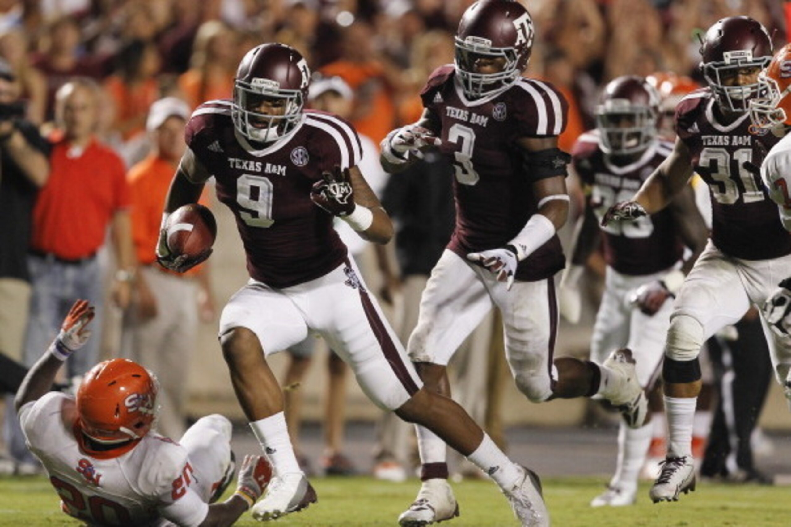 COLLEGE STATION, TX - SEPTEMBER 07:  Nate Askew #9 of the Texas A&M Aggies returns an interception for 30 yards for a touchdown in the third quarter against the Sam Houston State Bearkats in the  at Kyle Field on September 7, 2013 in College Station, Texa