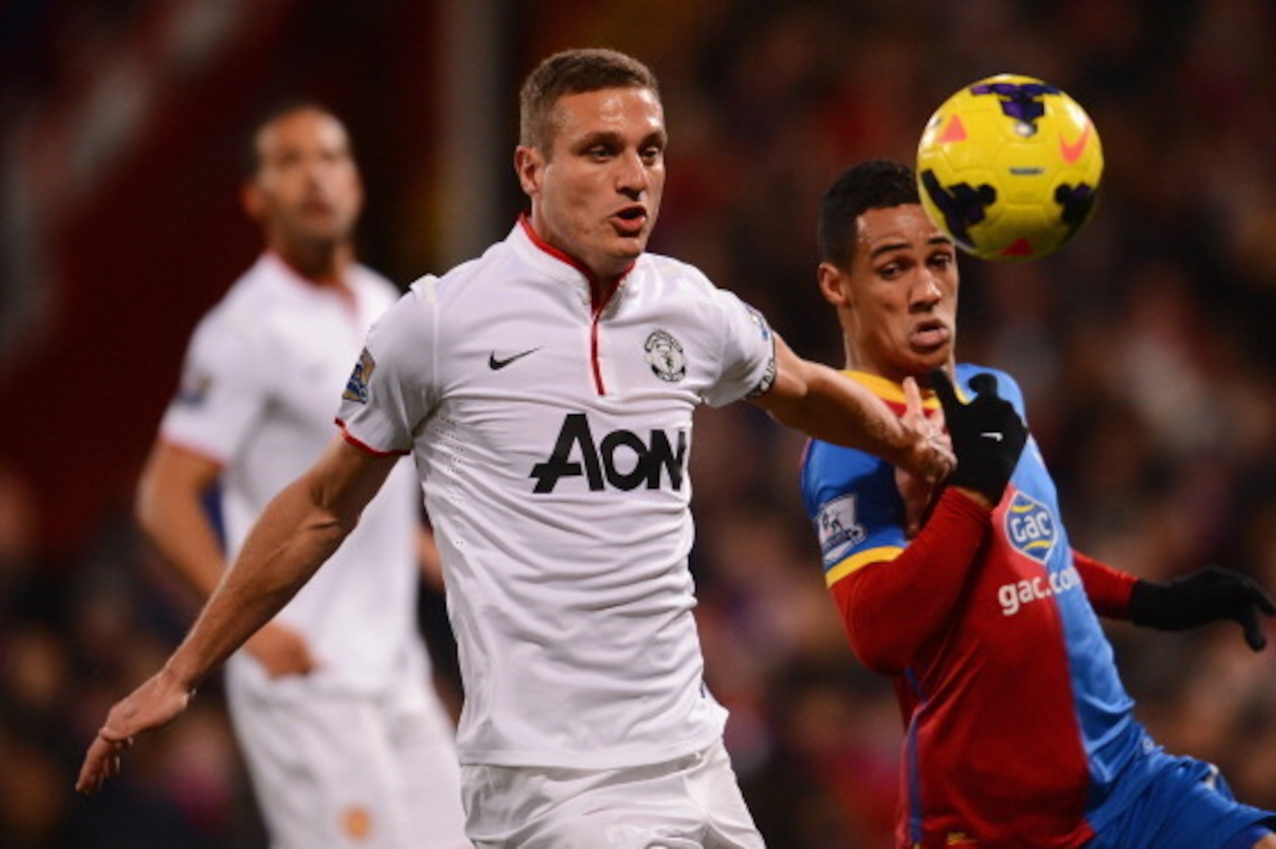 LONDON, ENGLAND - FEBRUARY 22:  Nemanja Vidic of Manchester United is challenged by Thomas Ince of Crystal Palace during the Barclays Premier League match between Crystal Palace and Manchester United at Selhurst Park on February 22, 2014 in London, Englan