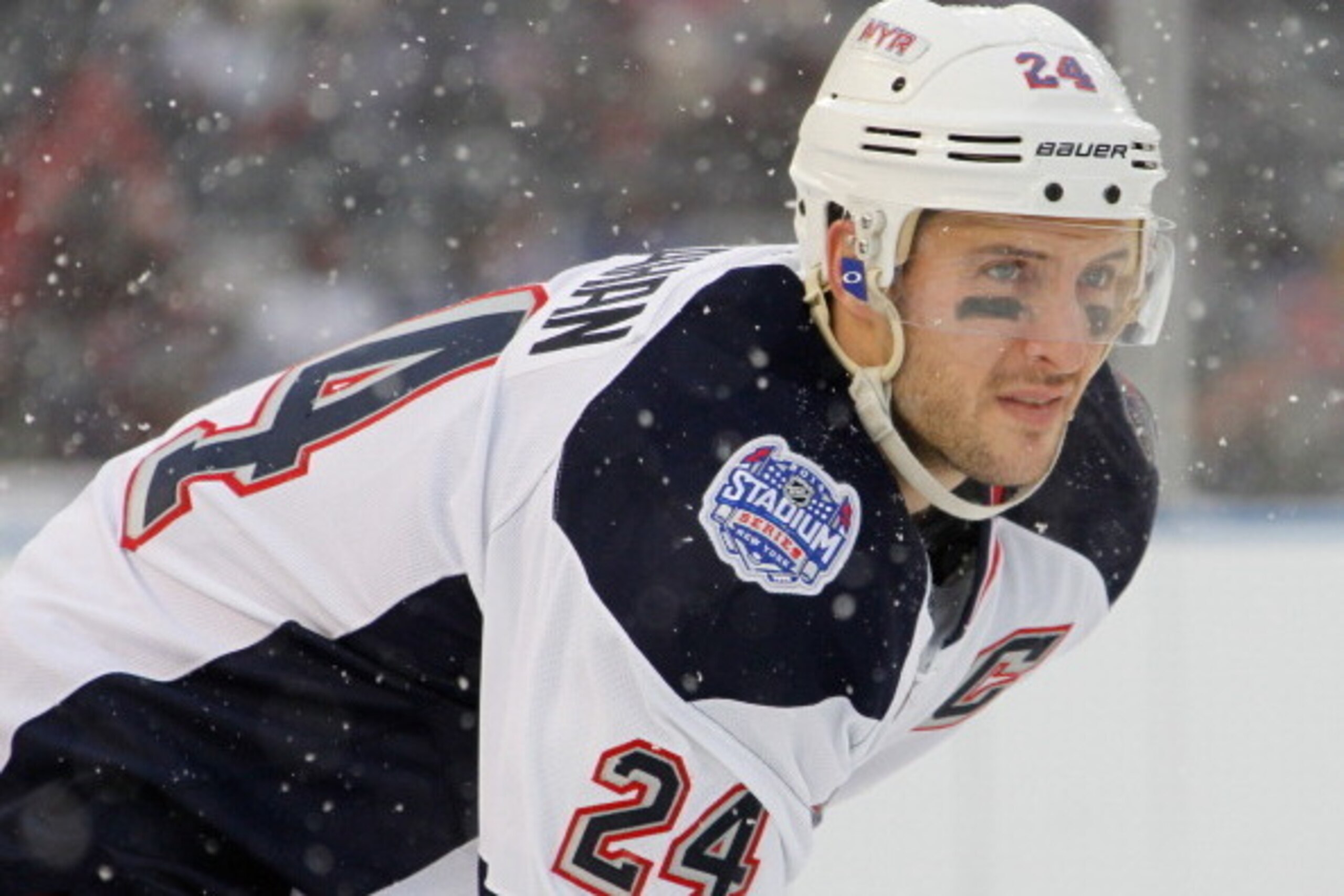 NEW YORK, NY - JANUARY 26:  (EDITORIAL USE ONLY) Ryan Callahan #24 of the New York Rangers looks on during a break in the action against the New Jersey Devils during the 2014 Coors Light NHL Stadium Series at Yankee Stadium on January 26, 2014 in the Bron
