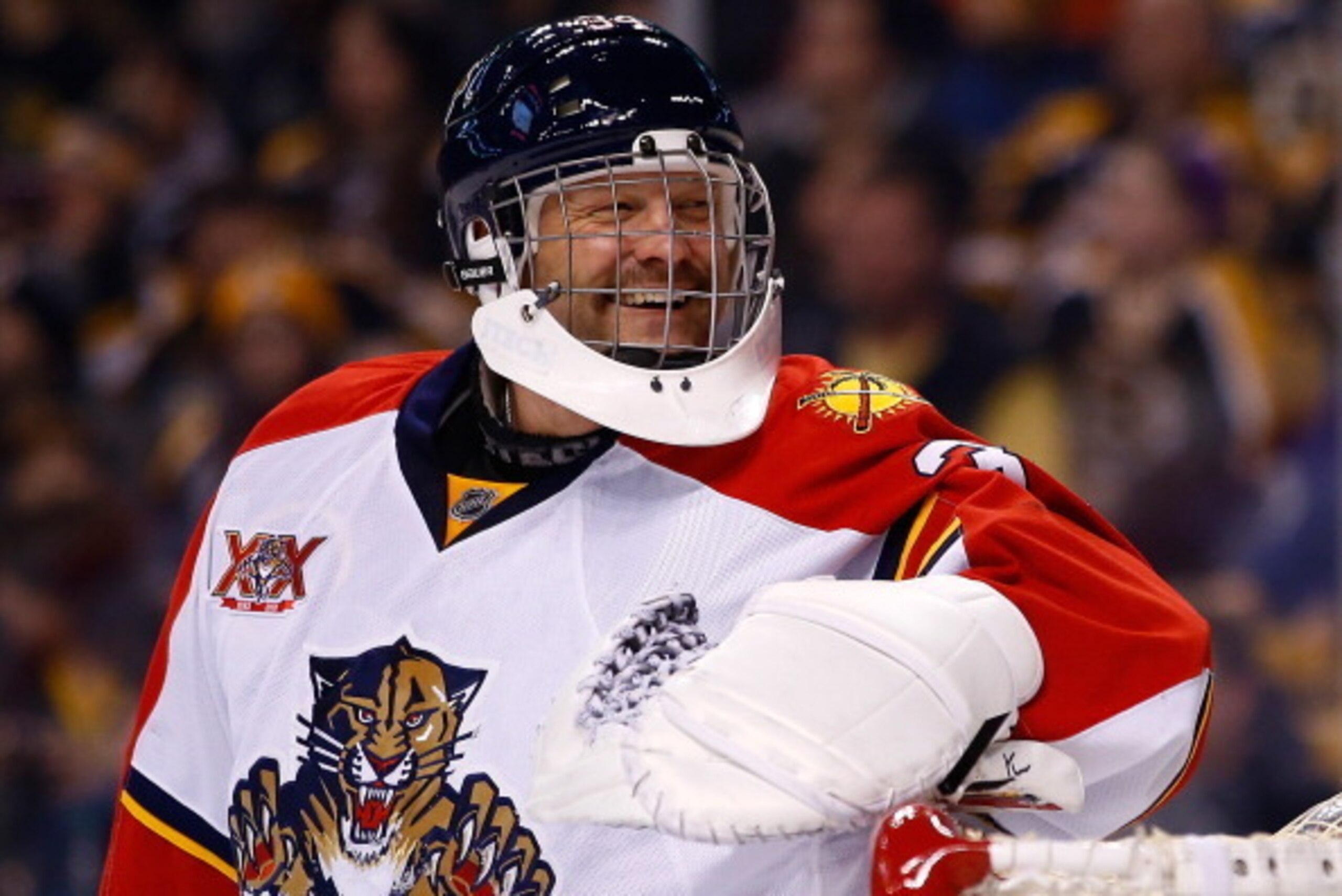 BOSTON, MA - MARCH 04: Tim Thomas #34 of the Florida Panthers laughs following a save in the first period against the Boston Bruins during the game at TD Garden on March 4, 2014 in Boston, Massachusetts.  (Photo by Jared Wickerham/Getty Images)