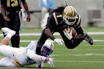 Crowell runs through a defender while playing for Alabama State.