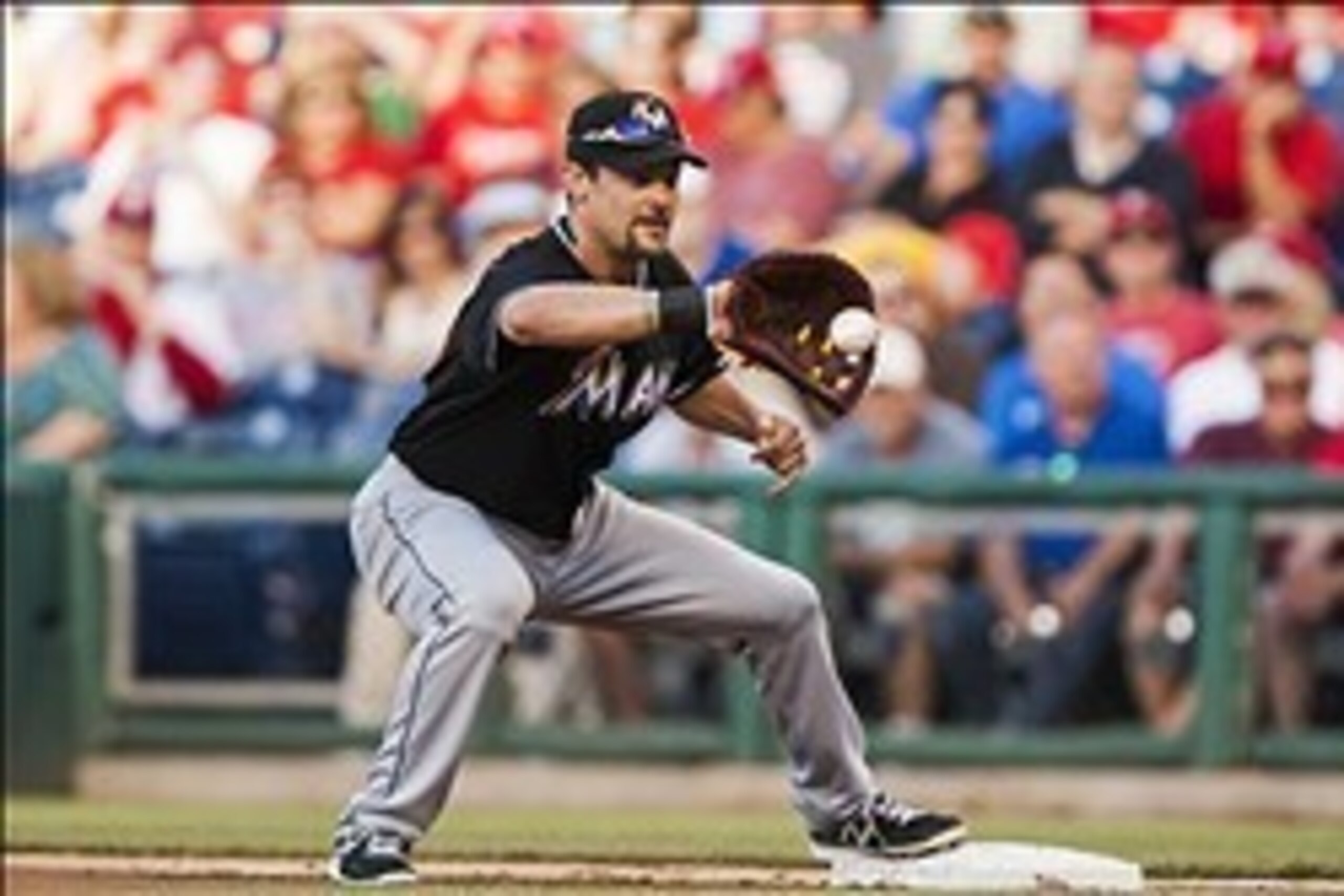 June 4, 2013; Philadelphia, PA, USA; Miami Marlins first baseman Casey Kotchman (18) records an out during the first inning against the Philadelphia Phillies at Citizens Bank Park. The Phillis defeated the Marlins 7-3 in 11 innings. Mandatory Credit: Howa June 4, 2013; Philadelphia, PA, USA; Miami Marlins first baseman Casey Kotchman (18) records an out during the first inning against the Philadelphia Phillies at Citizens Bank Park. The Phillis defeated the Marlins 7-3 in 11 innings. Mandatory Credit: Howa