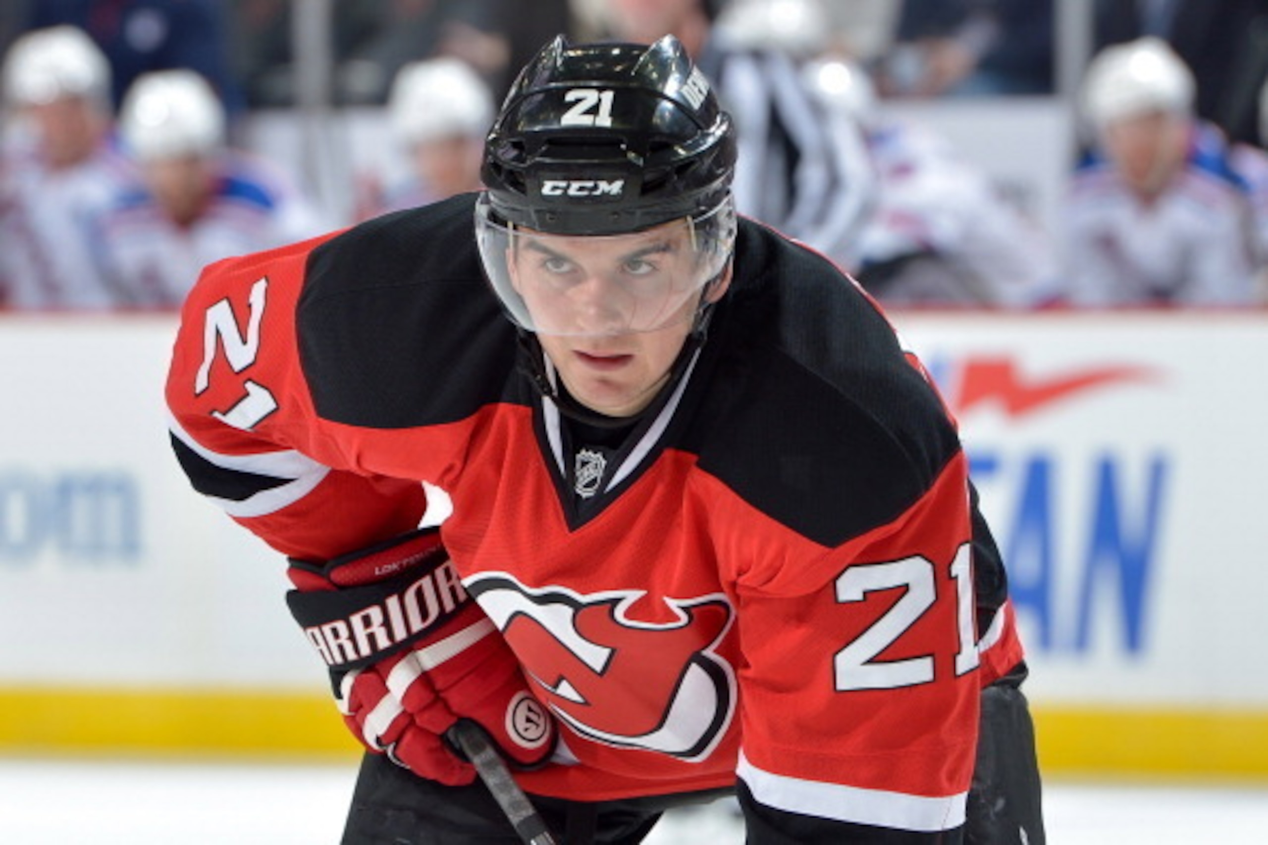 NEWARK, NJ - OCTOBER 19: Andrei Loktionov #21 of the New Jersey Devils gets set against the New York Rangers at the Prudential Center on October 19, 2013 in Newark, New Jersey. The Devils won 4-0. (Photo by Drew Hallowell/Getty Images)