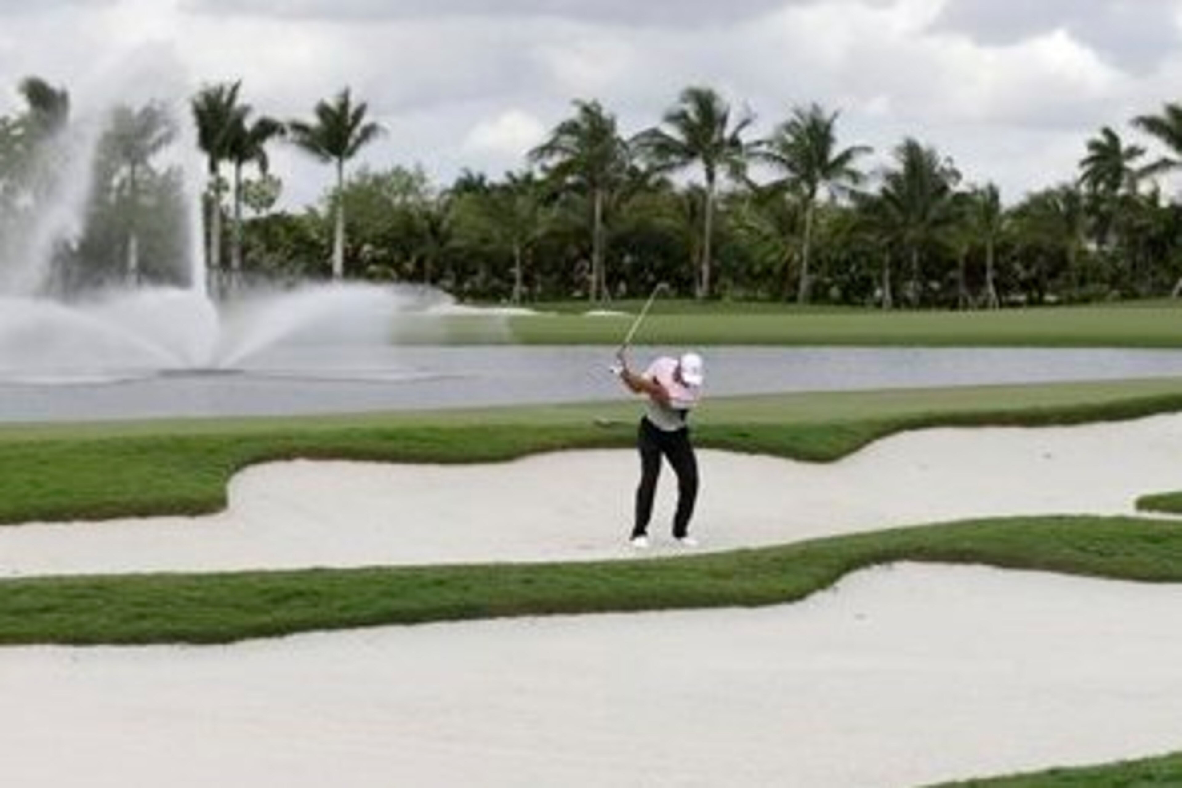 Tiger Woods  hit from bunkers at TPC Doral Blue Monster  Wednesday afternoon