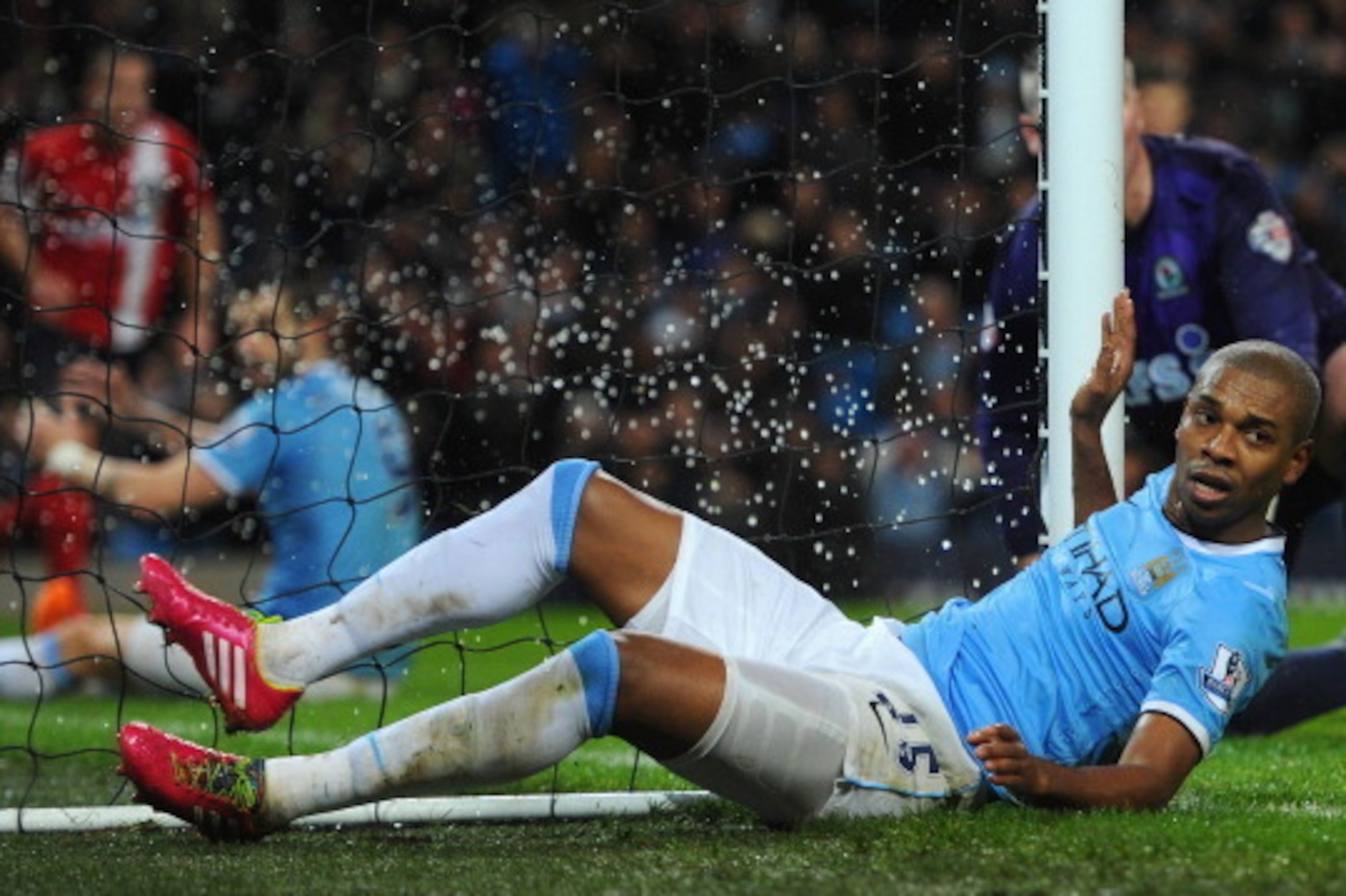MANCHESTER, ENGLAND - JANUARY 15:  Fernandinho of Manchester City collides with the net during the Budweiser FA Cup Third Round Replay match between Manchester City and Blackburn Rovers at the Etihad Stadium on January 15, 2014 in Manchester, England.  (P