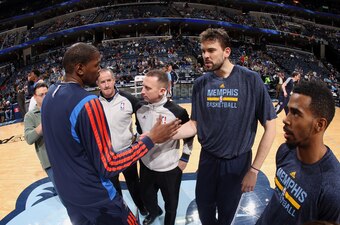 MEMPHIS, TN - JANUARY 14: Marc Gasol #33 and Mike Conley #11 of the Memphis Grizzlies greet Kevin Durant #35 of the Oklahoma City Thunder before a game on January 14, 2014 at FedExForum in Memphis, Tennessee. NOTE TO USER: User expressly acknowledges and