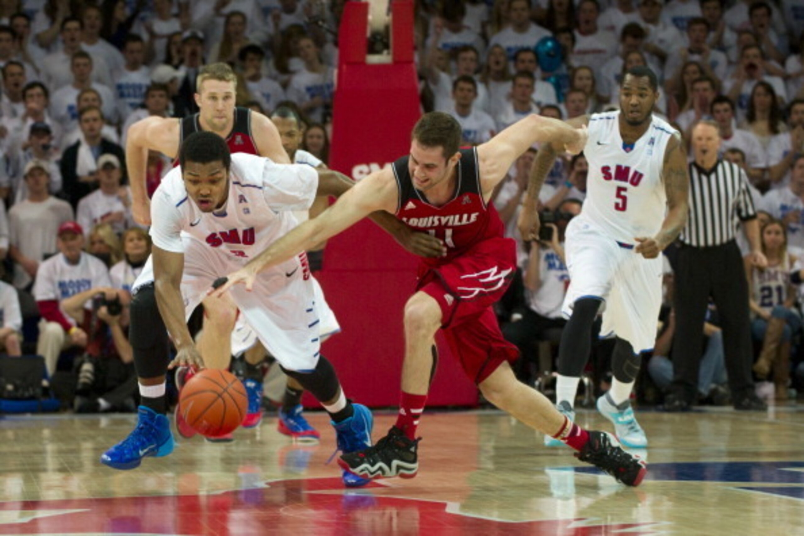 DALLAS, TX - FEBRUARY 5:  Sterling Brown #3 of the SMU Mustangs steals the ball from Luke Hancock #11 of the Louisville Cardinals on February 5, 2014 at Moody Coliseum in Dallas, Texas.  (Photo by Cooper Neill/Getty Images)