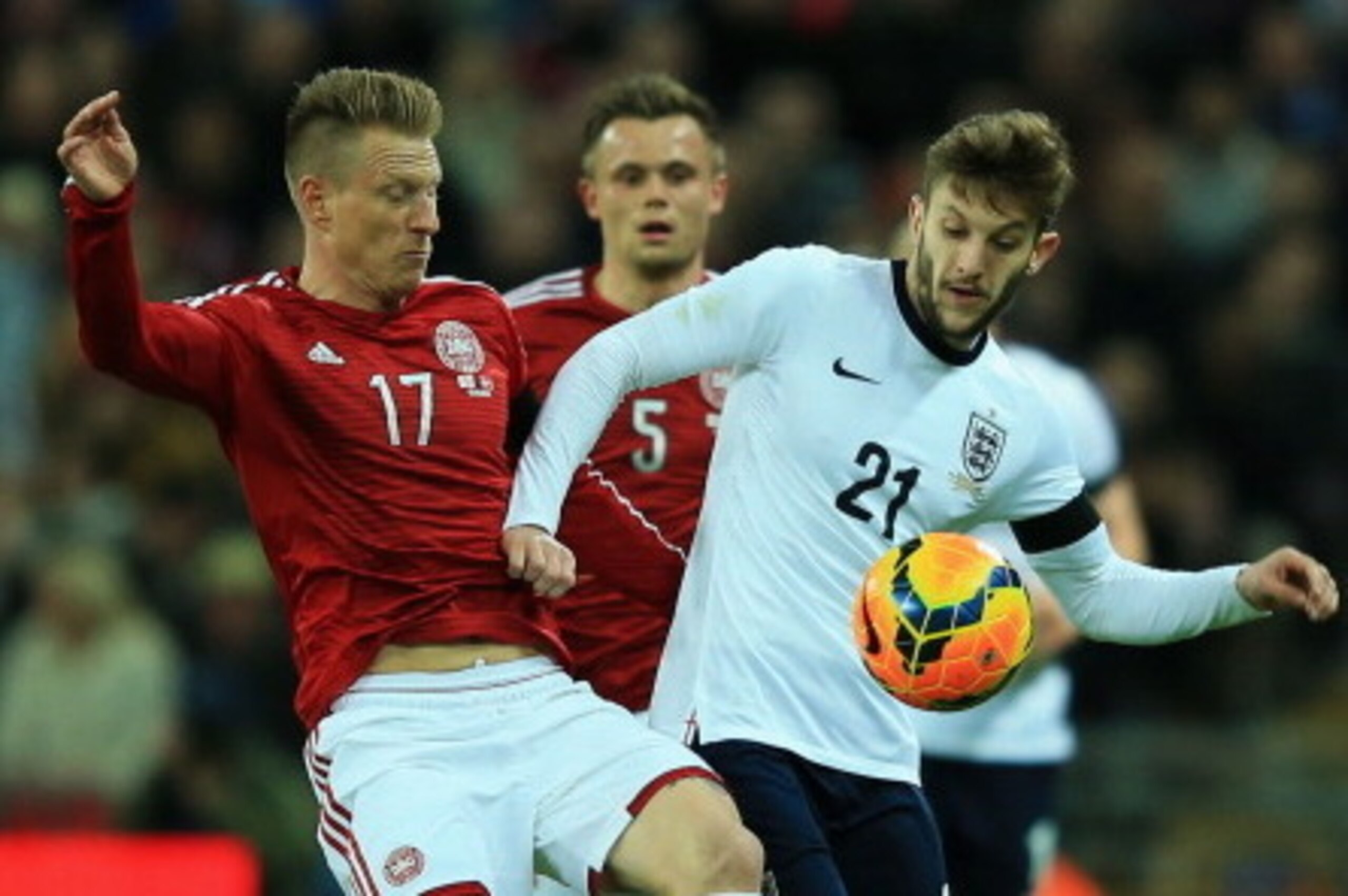 LONDON, ENGLAND - MARCH 05:  Adam Lallana of England challenges for the ball with Niki Zimling of Denmark during the International Friendly match between England and Denmark at Wembley Stadium on March 5, 2014 in London, England.  (Photo by Richard Heathc