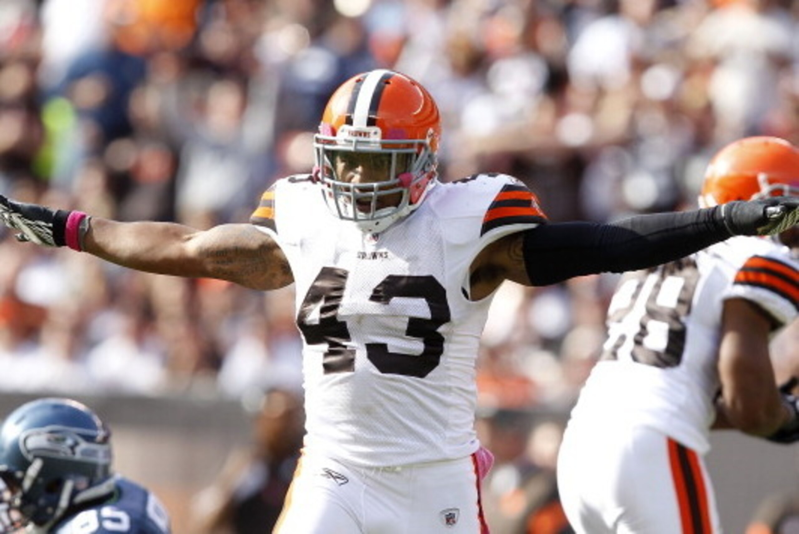 CLEVELAND, OH - OCTOBER 23:  Defensive back T.J. Ward #43 of the Cleveland Browns celebrates after an interception against the Seattle Seahawks at Cleveland Browns Stadium on October 23, 2011 in Cleveland, Ohio.  (Photo by Matt Sullivan/Getty Images)