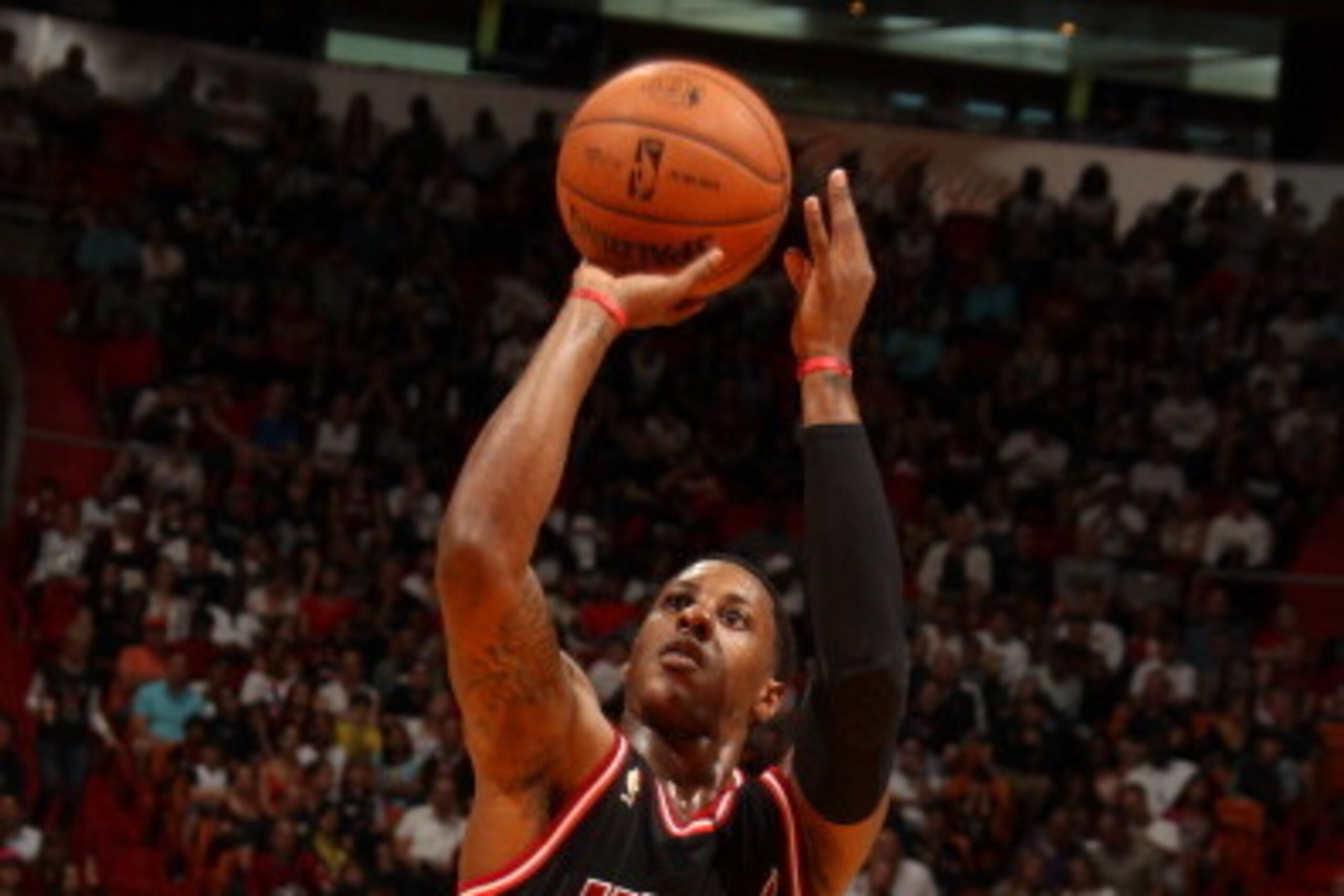 MIAMI, FL - JANUARY 26: Mario Chalmers #15 of the Miami Heat shoots the ball gainst the San Antonio Spurs at the American Airlines Arena in Miami, Florida on Jan. 26, 2014. NOTE TO USER: User expressly acknowledges and agrees that, by downloading and/or u