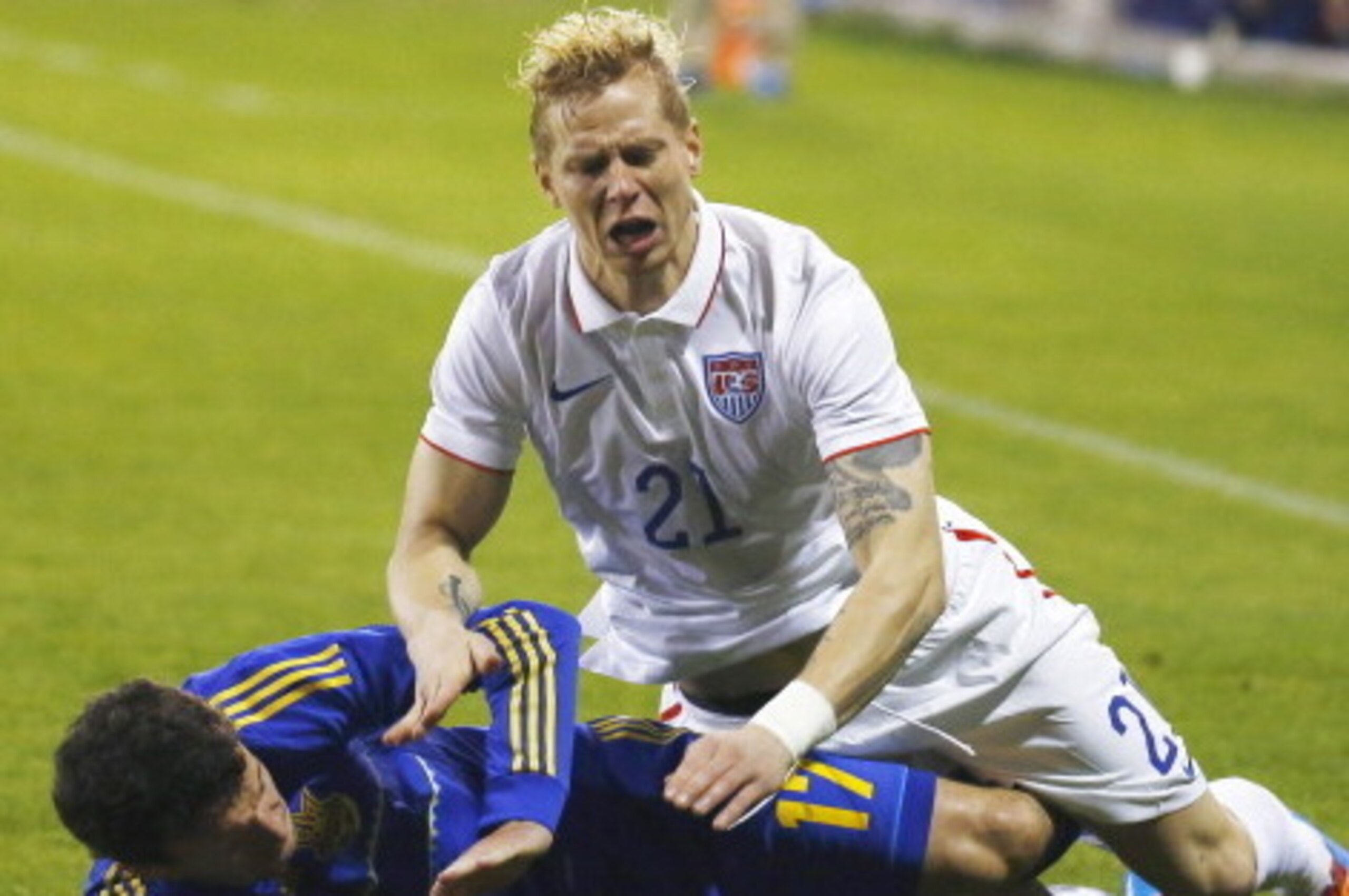 LARNACA, CYPRUS - MARCH 05:  Brek Shea (top) of the USA and Artem Fedets'Kyy of the Ukraine in action during the Ukraine v USA International Friendly  at Antonis Papadopoulos stadium on March 5, 2014 in Larnaca, Cyprus.  (Photo by Andrew Caballero-Reynold