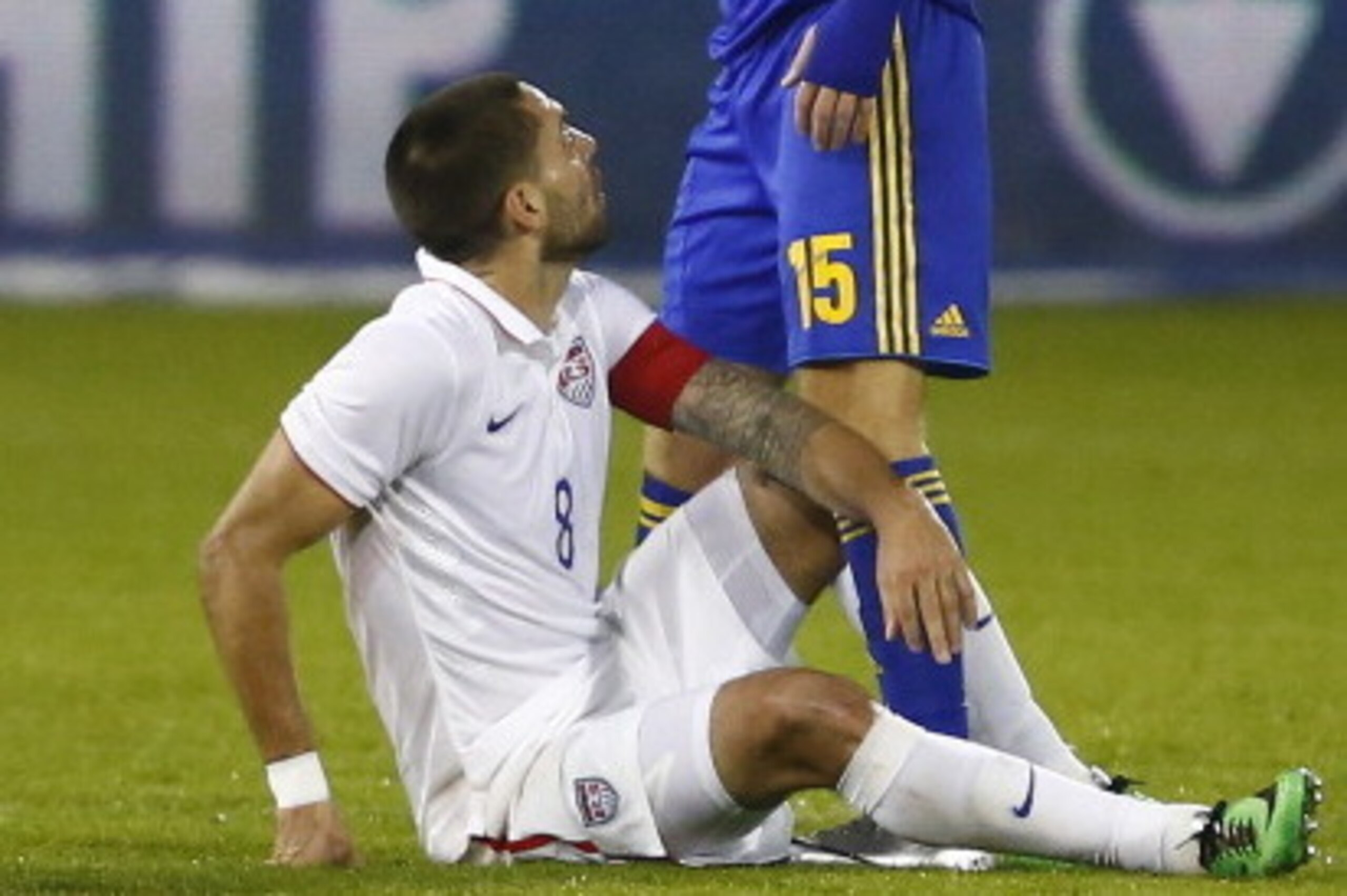 LARNACA, CYPRUS - MARCH 05: Roman Bezus (R)  of the Ukraine stands over Clint Dempsey of the USA during the Ukraine v USA International Friendly  at Antonis Papadopoulos stadium on March 5, 2014 in Larnaca, Cyprus.  (Photo by Andrew Caballero-Reynolds/Get