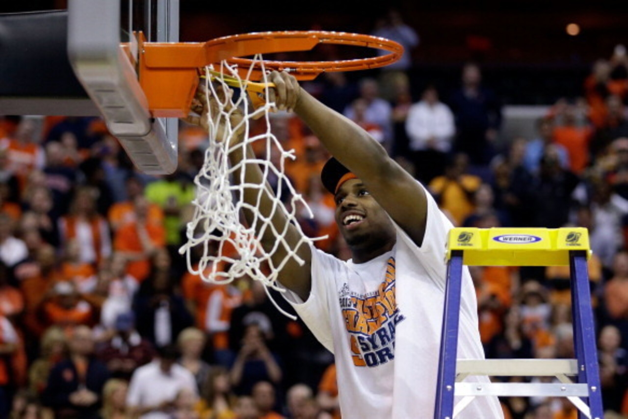 WASHINGTON, DC - MARCH 30:  C.J. Fair #5 of the Syracuse Orange cuts down the net after defeating the Marquette Golden Eagles to win the East Regional Round Final of the 2013 NCAA Men's Basketball Tournament at Verizon Center on March 30, 2013 in Washingt