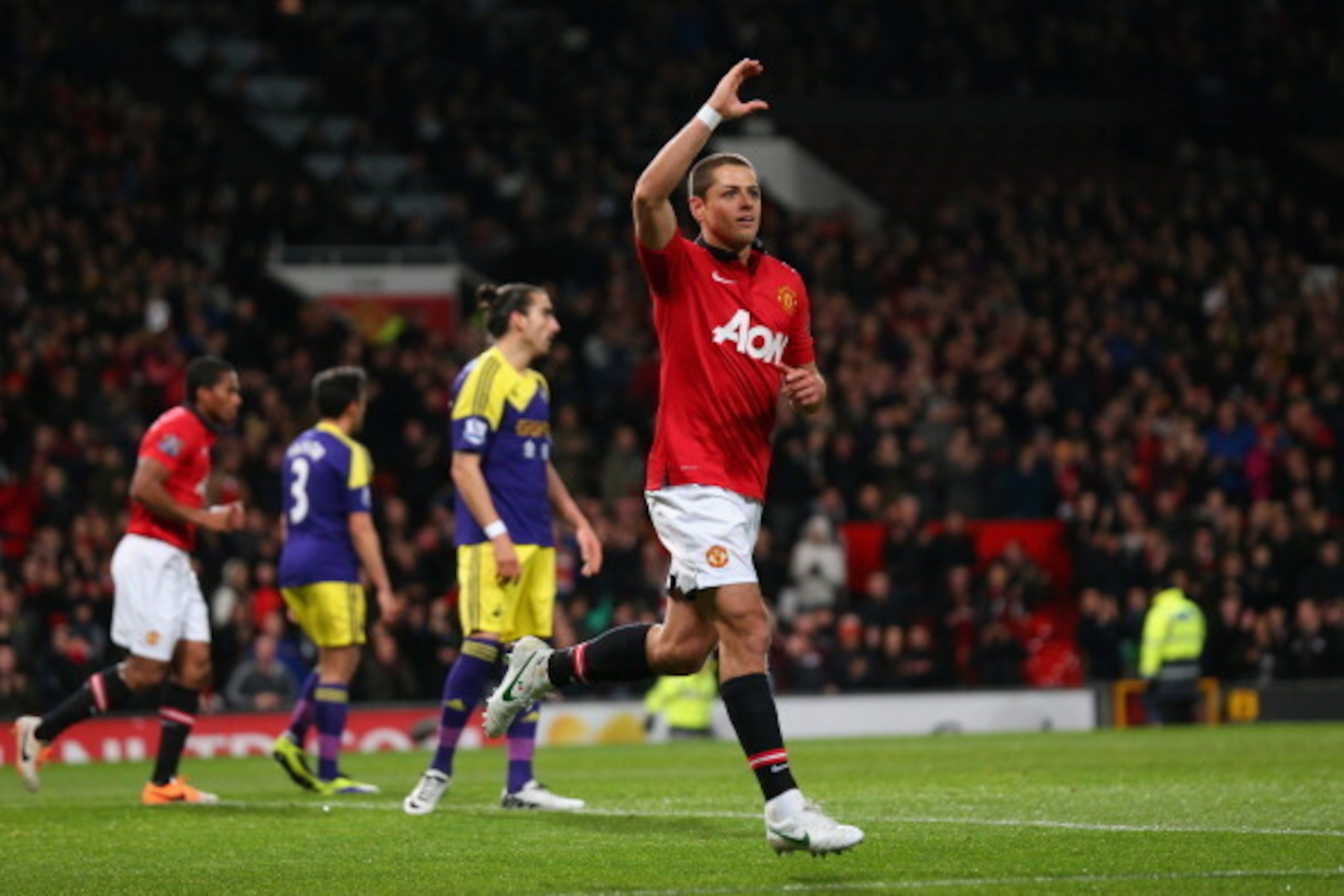 MANCHESTER, ENGLAND - JANUARY 05:  Javier Hernandez of Manchester United celebrates scoring his team's first goal during the FA Cup with Budweiser Third round match between Manchester United and Swansea City at Old Trafford on January 5, 2014 in Mancheste