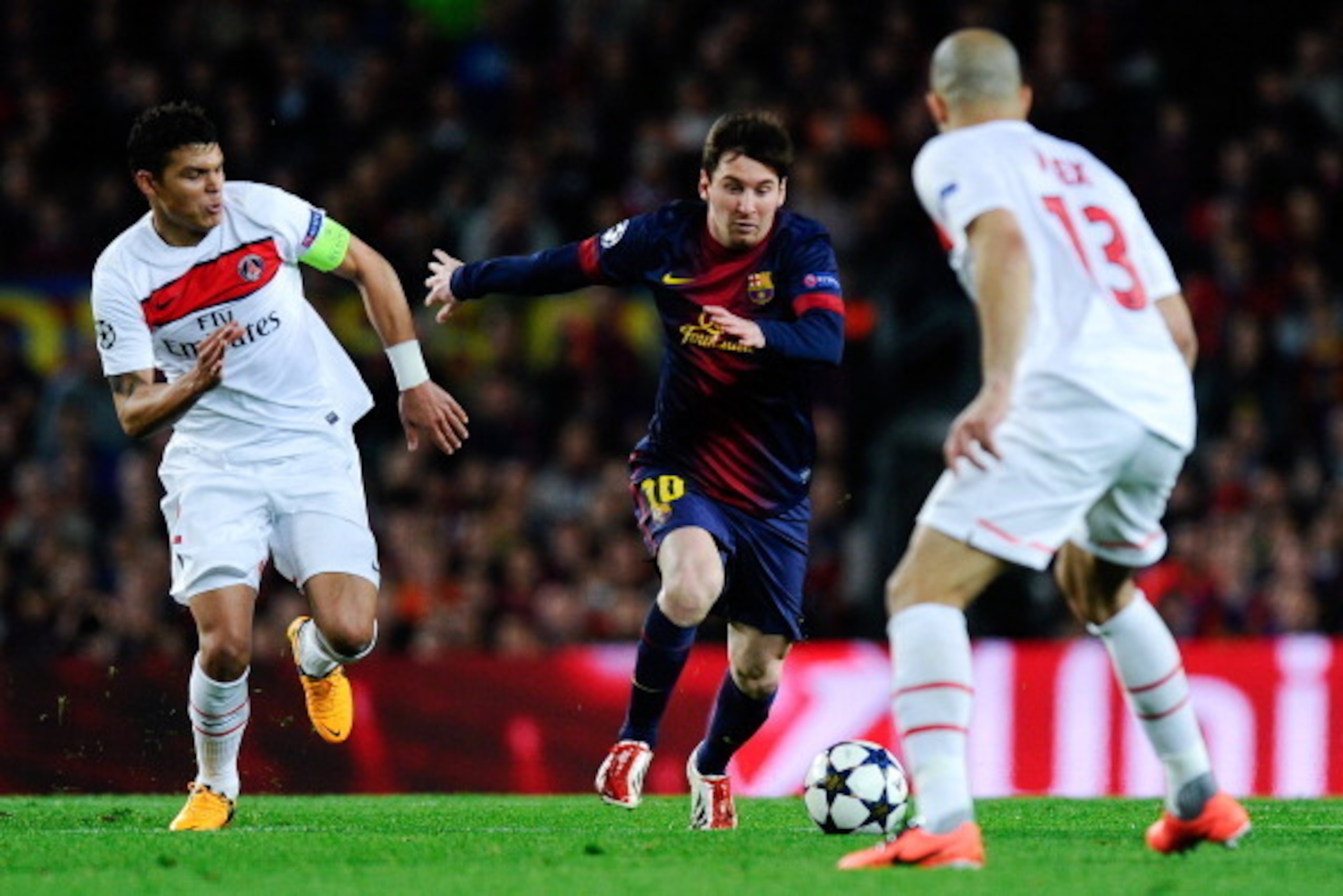 BARCELONA, SPAIN - APRIL 10:  Lionel Messi of FC Barcelona duels for the ball with Thiago Silva of Paris Saint-Germain and Alex of Paris Saint-Germain during the UEFA Champions League quarter-final second leg match between Barcelona and Paris St Germain a