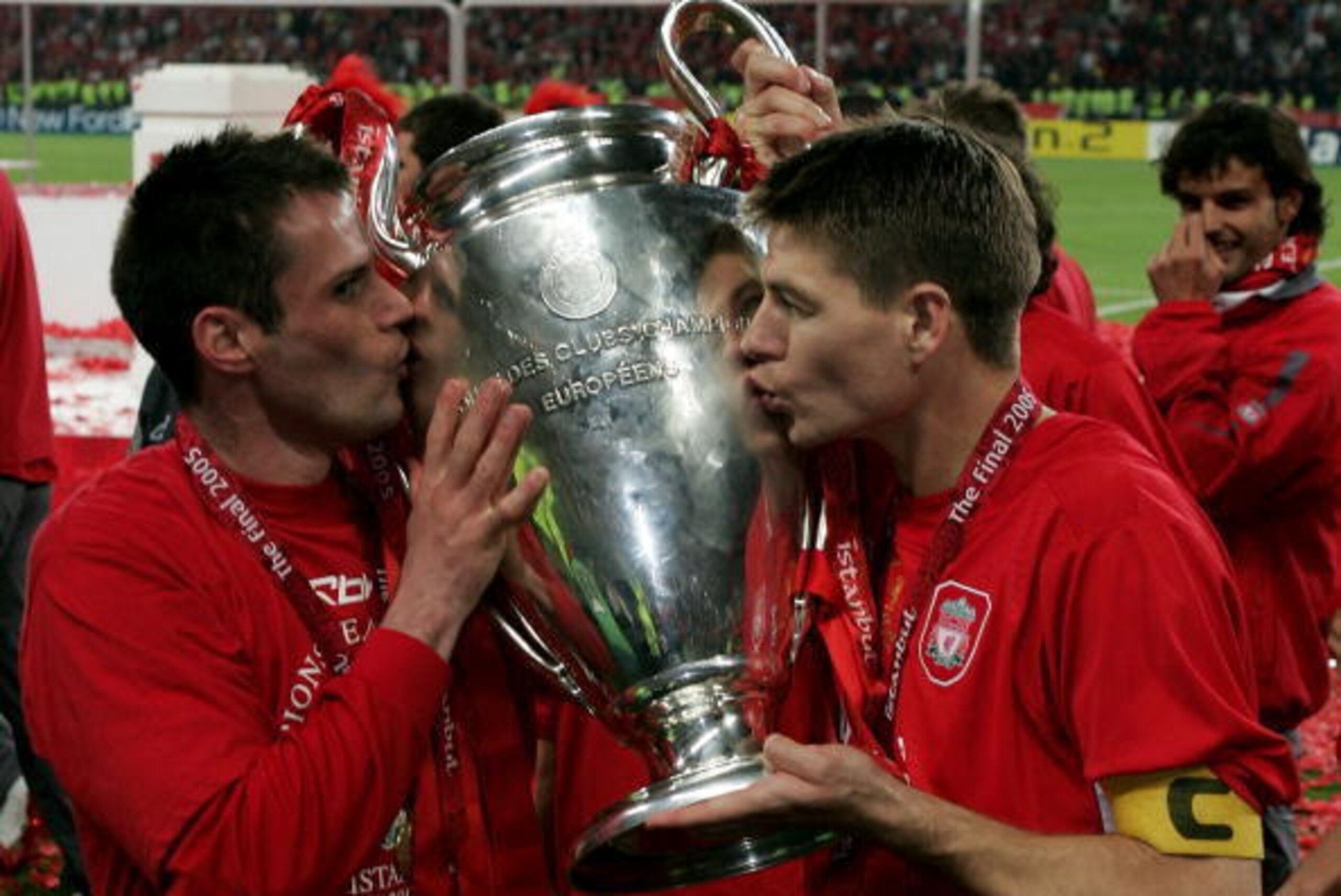 ISTANBUL, TURKEY - MAY 25:  Liverpool captain Steven Gerrard (R) and defender Jamie Carragher kiss the European Cup after Liverpool won the European Champions League final against AC Milan on May 25, 2005 at the Ataturk Olympic Stadium in Istanbul, Turkey