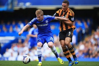 LONDON, ENGLAND - AUGUST 18:  Kevin De Bruyne of Chelsea is challenged by James Chester of Hull City during the Barclays Premier League match between Chelsea and Hull City at Stamford Bridge on August 18, 2013 in London, England.  (Photo by Richard Heathc