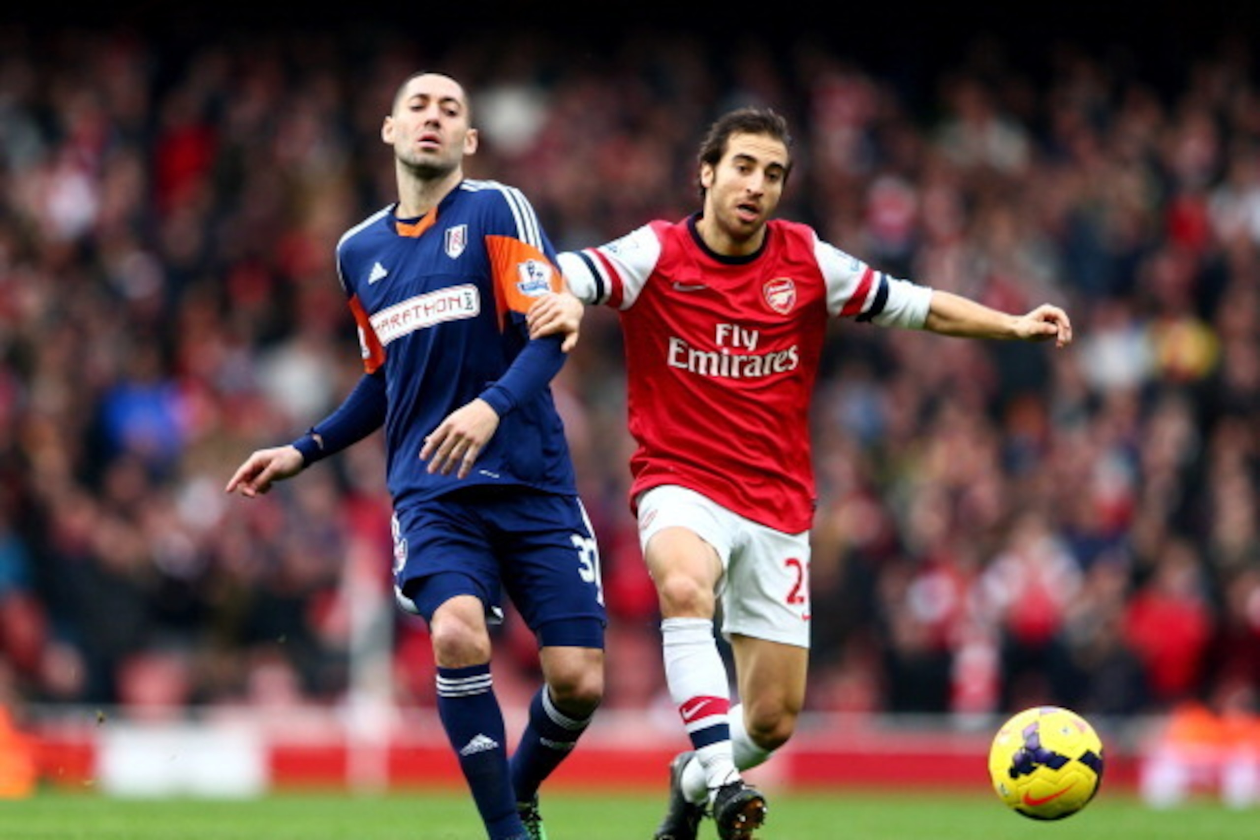 LONDON, ENGLAND - JANUARY 18: Mathieu Flamini of Arsenal holds off Clint Dempsey of Fulham during the Barclays Premier League match between Arsenal and Fulham at Emirates Stadium on January 18, 2014 in London, England. (Photo by Clive Mason/Getty Images LONDON, ENGLAND - JANUARY 18: Mathieu Flamini of Arsenal holds off Clint Dempsey of Fulham during the Barclays Premier League match between Arsenal and Fulham at Emirates Stadium on January 18, 2014 in London, England. (Photo by Clive Mason/Getty Images