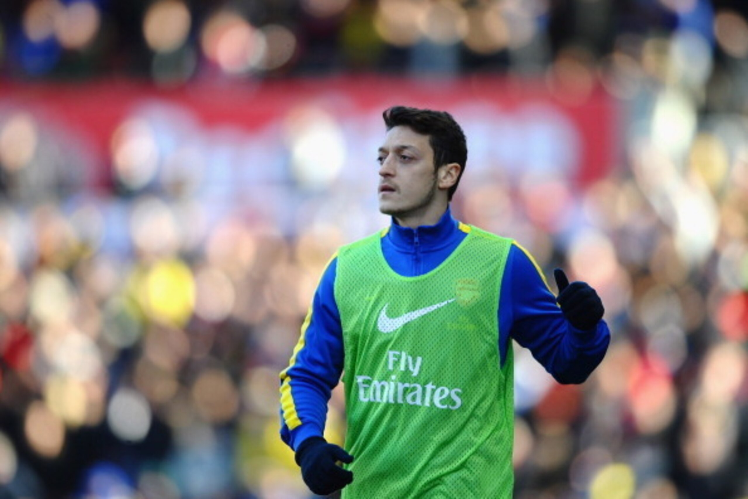 STOKE ON TRENT, ENGLAND - MARCH 01: Mesut Ozil of Arsenal warms up as a substitute during the Barclays Premier League match between Stoke City and Arsenal at Britannia Stadium on March 1, 2014 in Stoke on Trent, England. (Photo by Laurence Griffiths/Get STOKE ON TRENT, ENGLAND - MARCH 01: Mesut Ozil of Arsenal warms up as a substitute during the Barclays Premier League match between Stoke City and Arsenal at Britannia Stadium on March 1, 2014 in Stoke on Trent, England. (Photo by Laurence Griffiths/Get