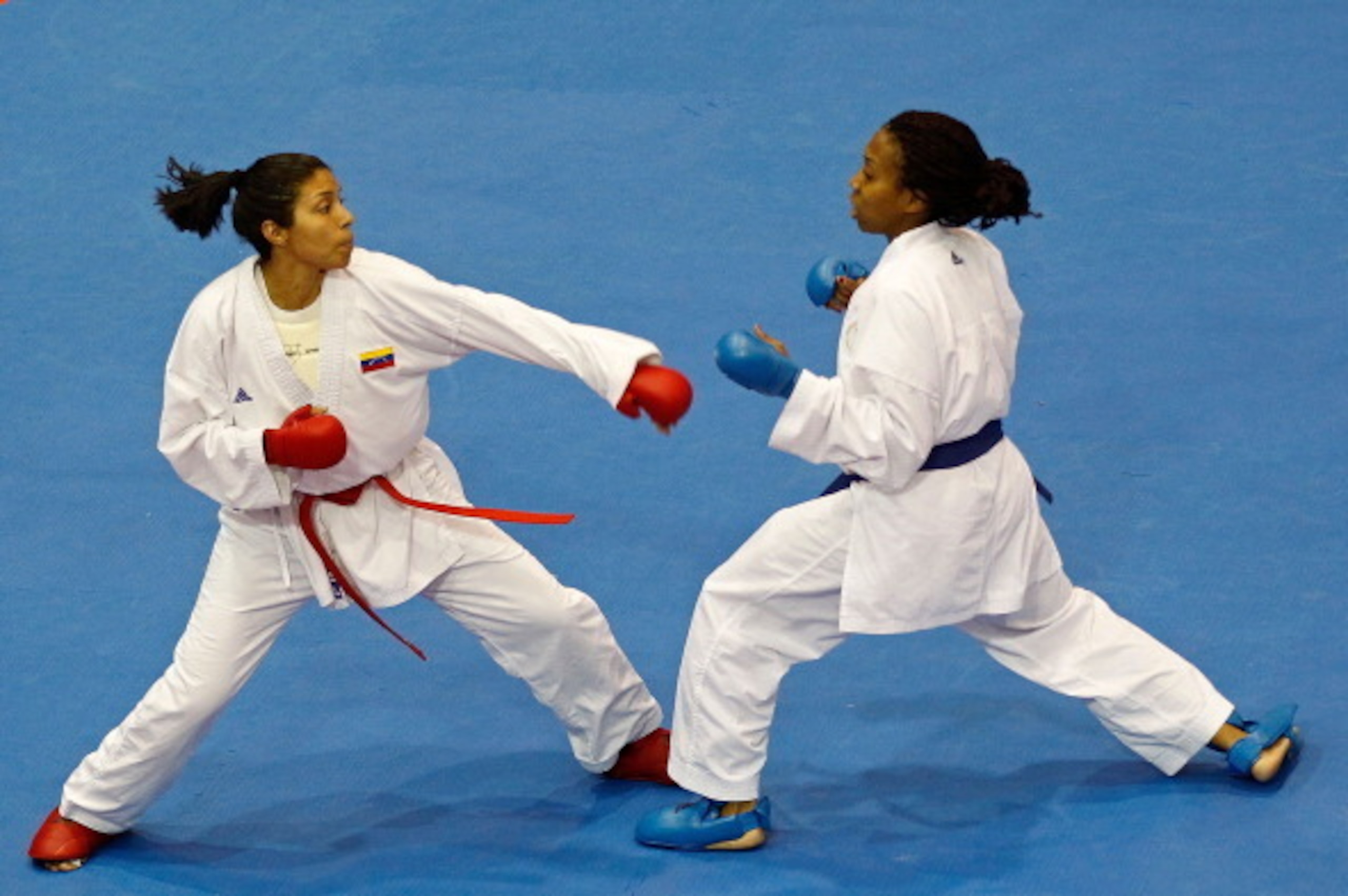 GUADALAJARA, MEXICO - OCTOBER 28:  Cheryl Murphy of the USA (Blue) fights Yoly Guillen of Venezuela during a Karate match during Day 14 of the XVI Pan American Games at the San Rafael Parks Sports Complex on October 28, 2011 in Guadalajara, Mexico.  (Phot