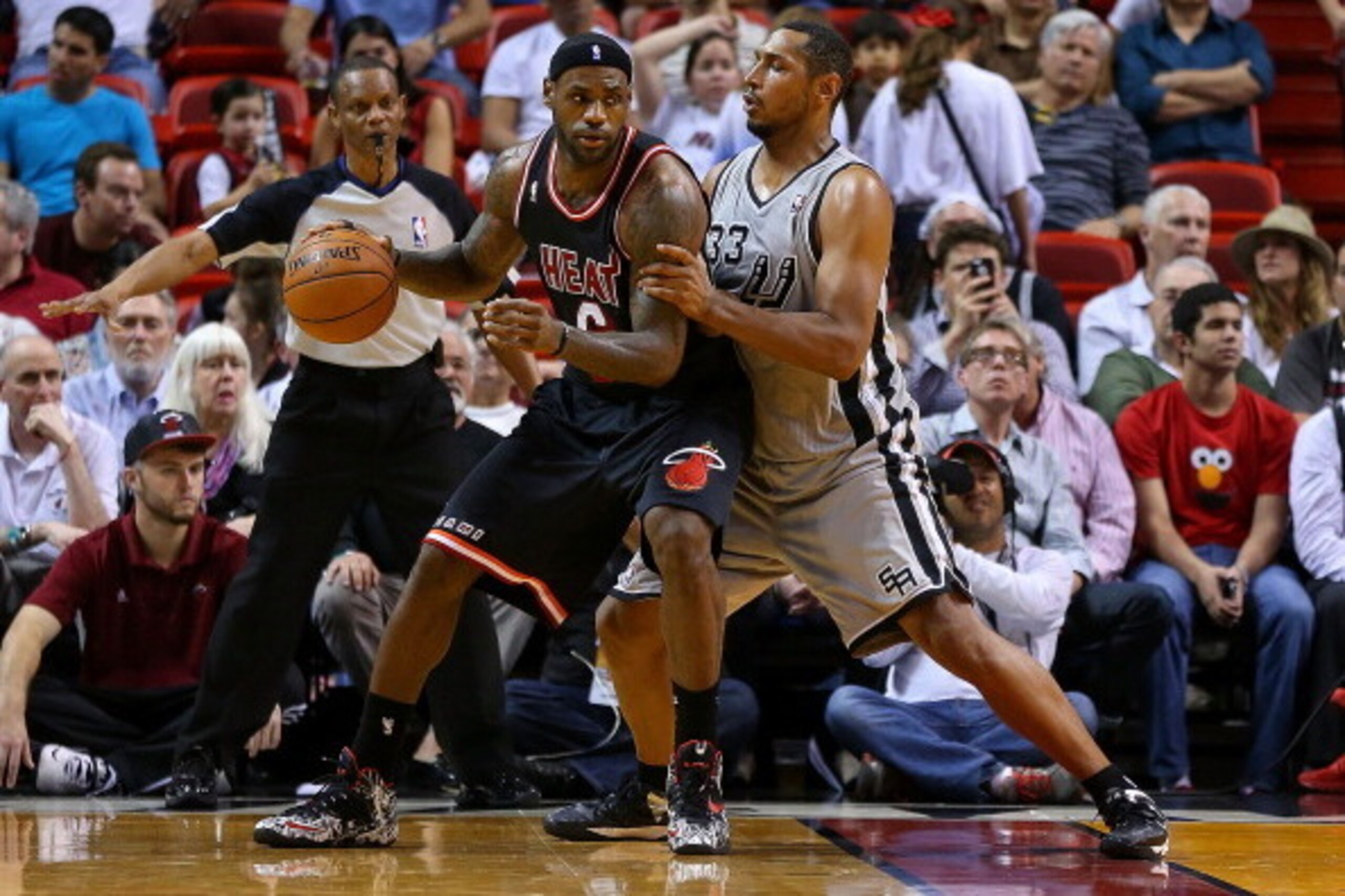 MIAMI, FL - JANUARY 26: LeBron James #6 of the Miami Heat posts up Boris Diaw #33 of the San Antonio Spurs during a game  at American Airlines Arena on January 26, 2014 in Miami, Florida. NOTE TO USER: User expressly acknowledges and agrees that, by downl