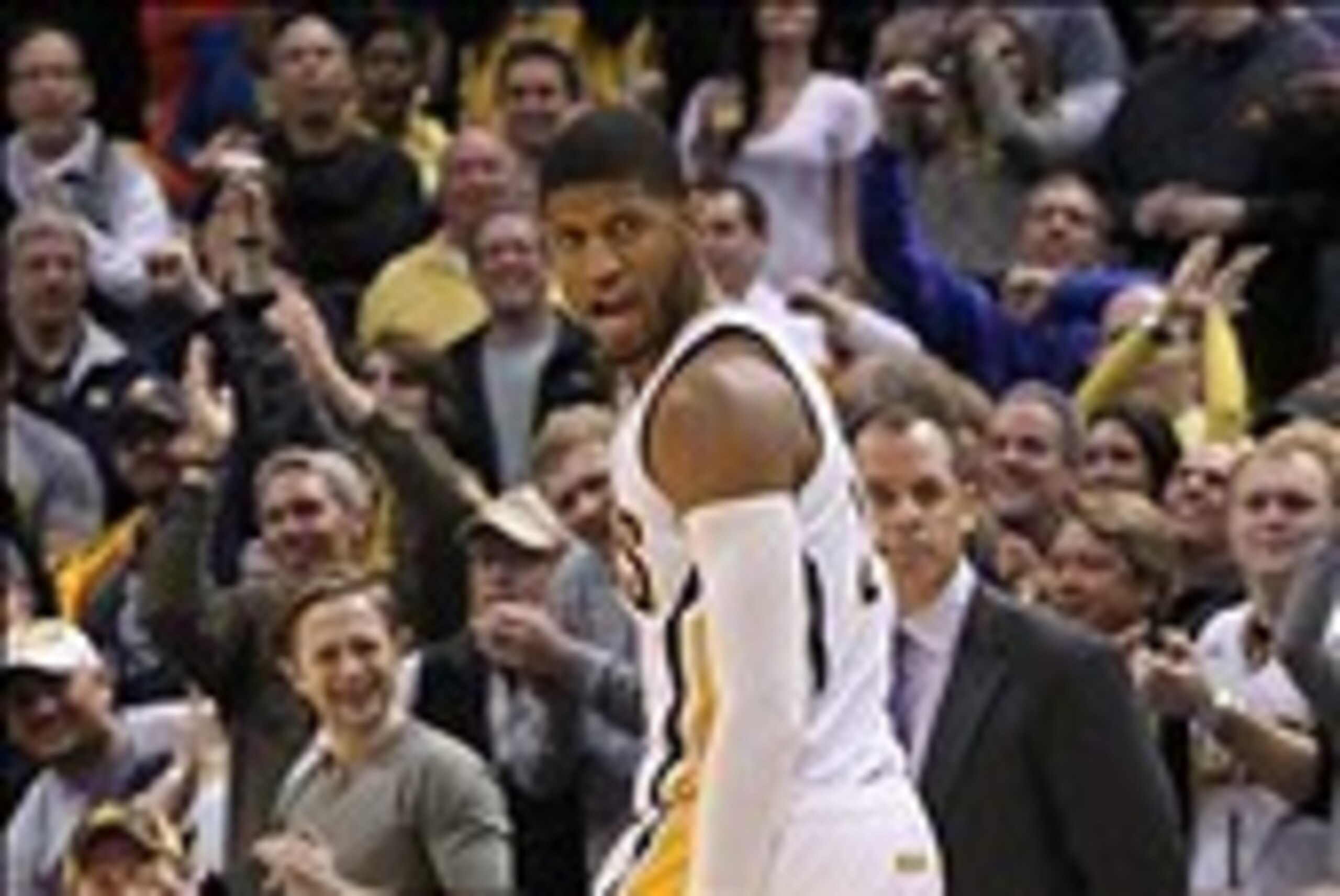 Mar 4, 2014; Indianapolis, IN, USA; Indiana Pacers forward Paul George (24) reacts to scoring late in the game against the Golden State Warriors at Bankers Life Fieldhouse. Golden State defeats Indiana 98-96. Mandatory Credit: Brian Spurlock-USA TODAY Spo
