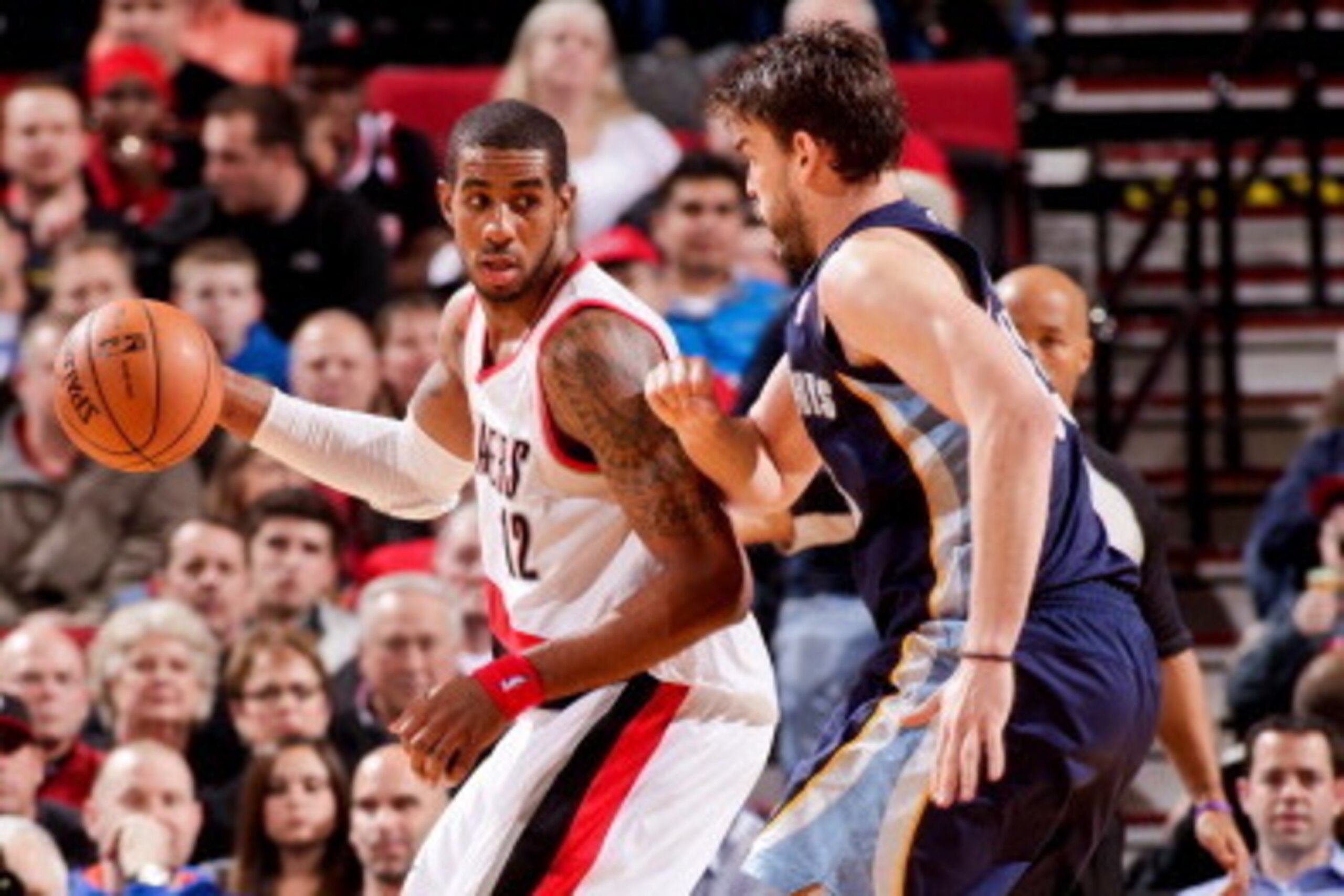 PORTLAND, OR - MARCH 12: LaMarcus Aldridge #12 of the Portland Trail Blazers posts-up against Marc Gasol #33 of the Memphis Grizzlies on March 12, 2013 at the Rose Garden Arena in Portland, Oregon. NOTE TO USER: User expressly acknowledges and agrees that