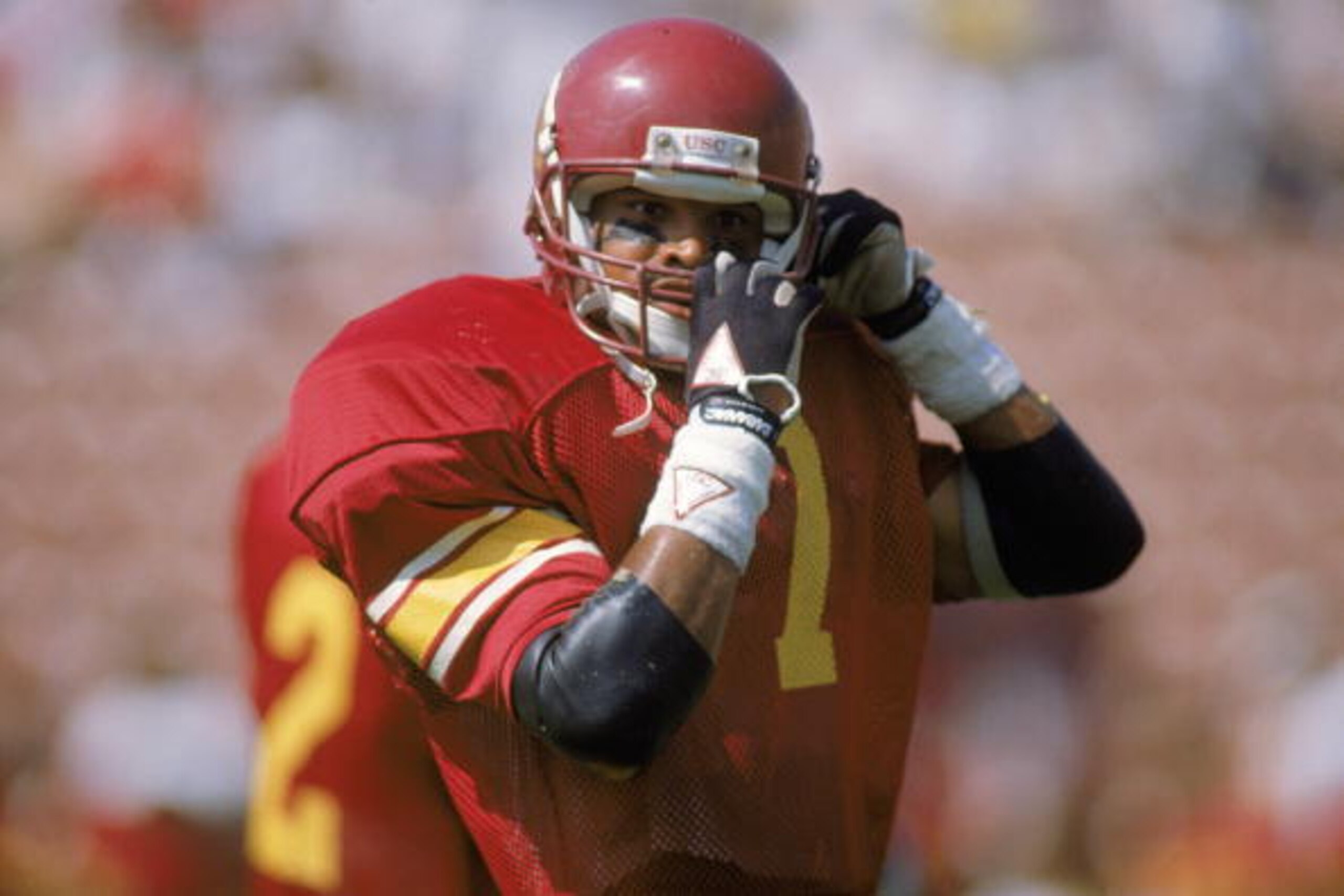 LOS ANGELES - SEPTEMBER 23:  Mark Carrier #7 of the University of Southern California Trojans straps down his helmet during the NCAA game against the Ohio State University Buckeyes at Los Angeles Memorial Coliseum on September 23, 1989 in Los Angeles, Cal