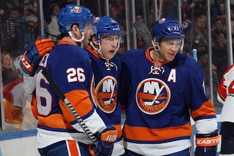 UNIONDALE, NY - MARCH 02: Ryan Strome #18 of the New York Islanders (C) celebrates his second period goal against the Florida Panthers along with Thomas Vanek #26 (L) and Kyle Okposo #21 (R) at the Nassau Veterans Memorial Coliseum on March 2, 2014 in Uni
