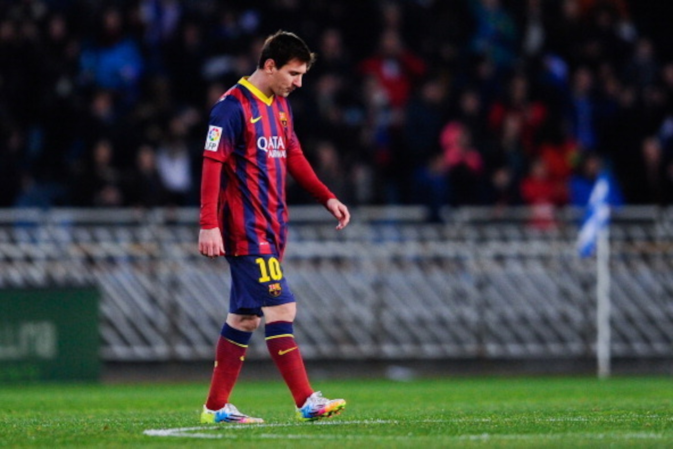 SAN SEBASTIAN, SPAIN - FEBRUARY 22:  Lionel Messi of FC Barcelona reacts after Antoine Griezmann of Real Sociedad scored his team's second goal goal during the La Liga match between Real Sociedad and FC Barcelona at Estadio Anoeta on February 22, 2014 in 