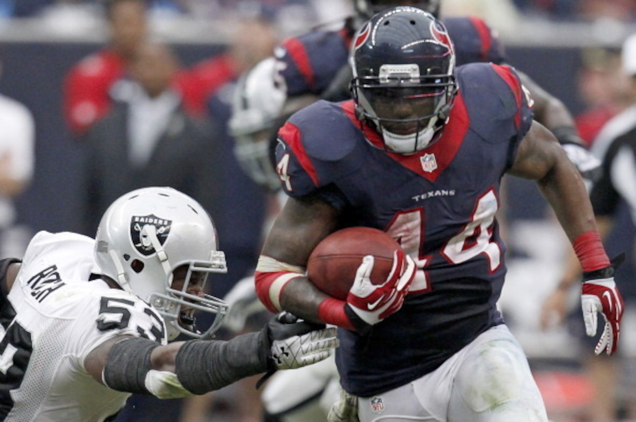 HOUSTON, TX- NOVEMBER 17: Ben Tate #44 of the Houston Texans rushes past Nick Roach #53 of the Oakland Raiders on November 17, 2013 at Reliant Stadium in Houston, Texas. Raiders won 28 to 23.(Photo by Thomas B. Shea/Getty Images)