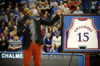 Feb 16, 2013; Lawrence, KS, USA; Former Kansas Jayhawks guard Mario Chalmers talks to the crowd as his jersey is retired during halftime of the game against the Texas Longhorns at Allen Fieldhouse. Mandatory Credit: John Rieger-USA TODAY Sports