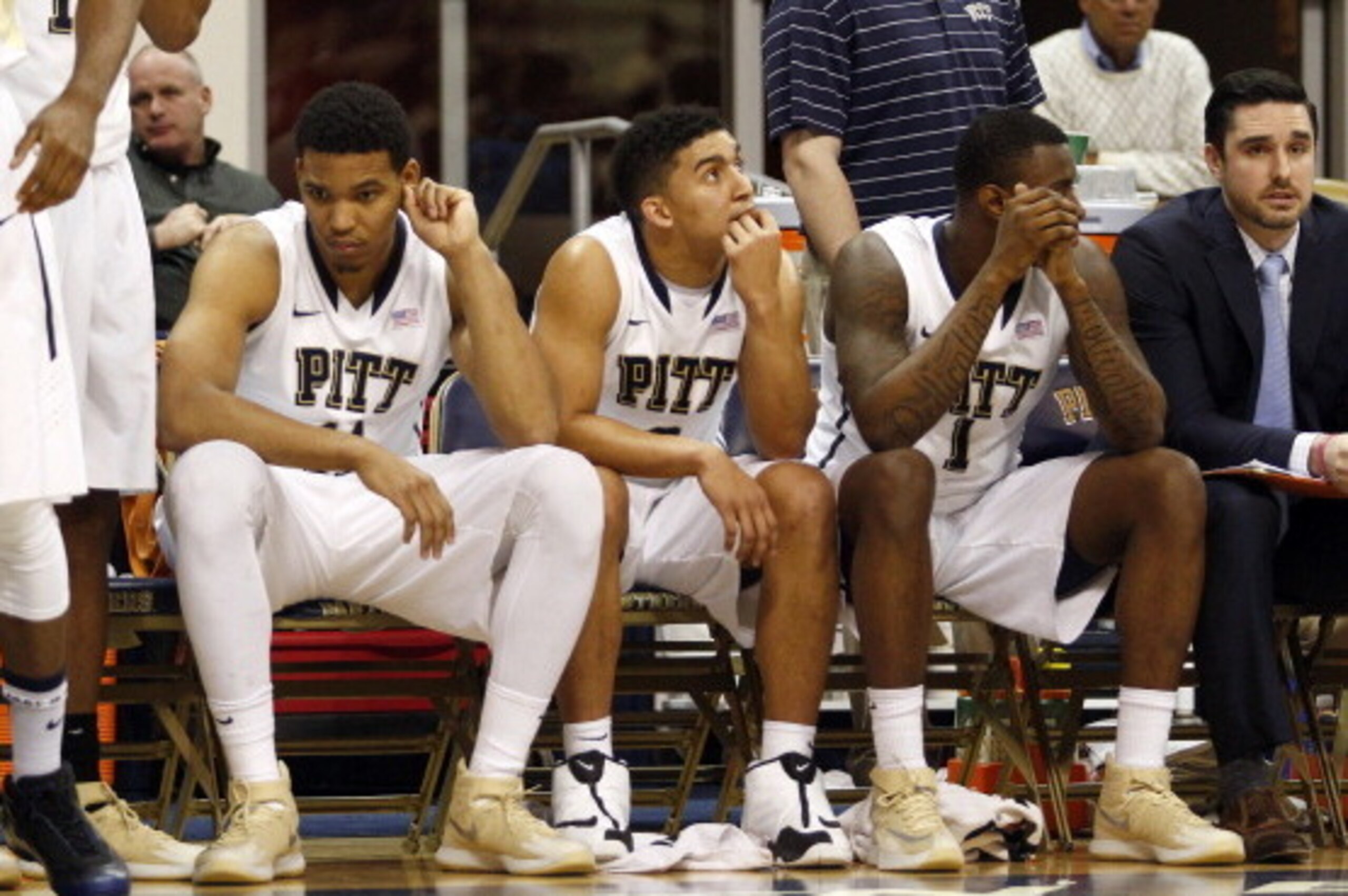 PITTSBURGH, PA - MARCH 03:  Derrick Randall #11, James Robinson #0 and Jamel Artis #1 of the Pittsburgh Panthers react to losing to the North Carolina State Wolfpack 74-67 at Petersen Events Center on March 3, 2014 in Pittsburgh, Pennsylvania.  (Photo by 