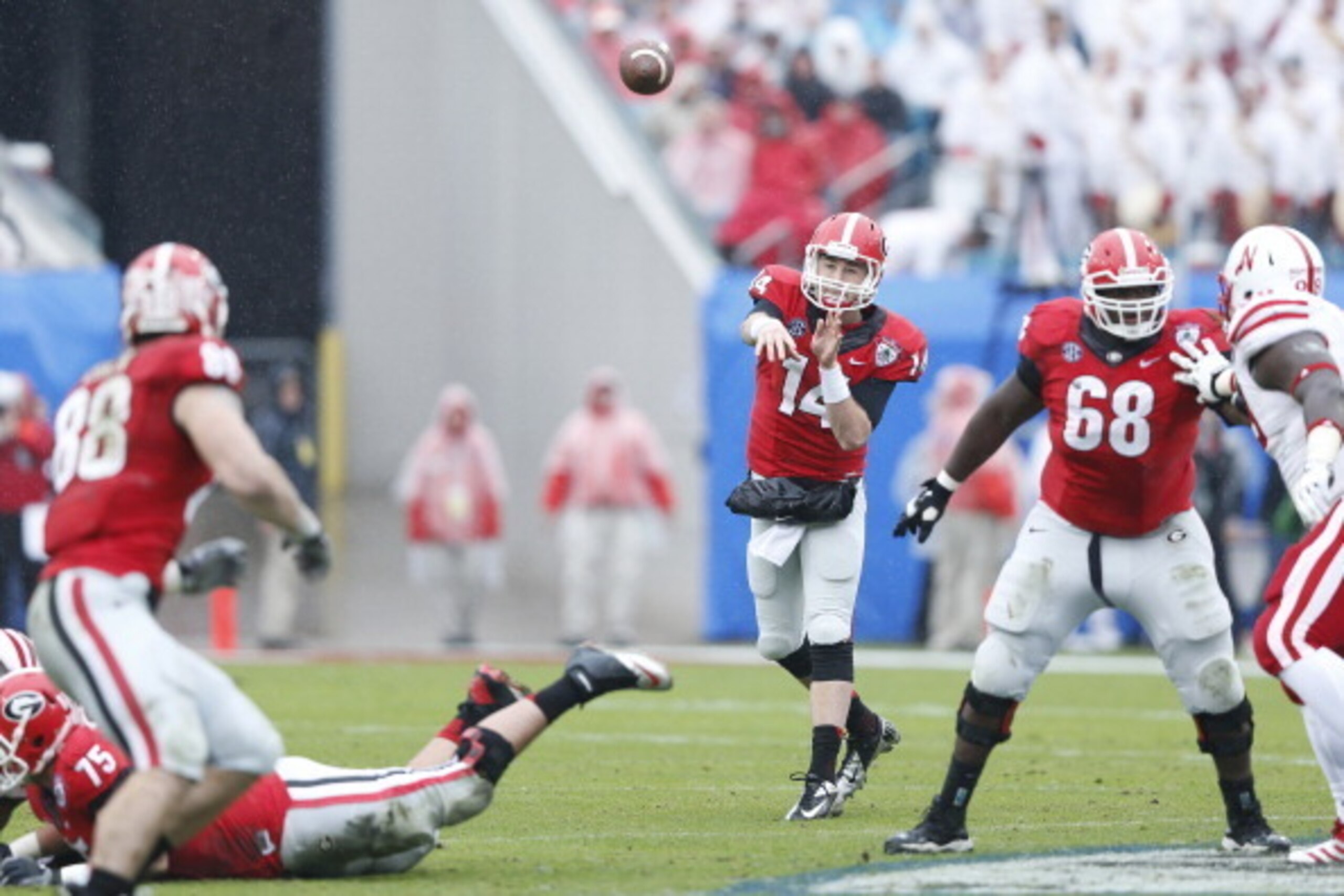 JACKSONVILLE, FL - JANUARY 1: Hutson Mason #14 of the Georgia Bulldogs throws a pass in the first half against the Nebraska Cornhuskers during the TaxSlayer.com Gator Bowl at Everbank Field on January 1, 2014 in Jacksonville, Florida. (Photo by Joe Robbin