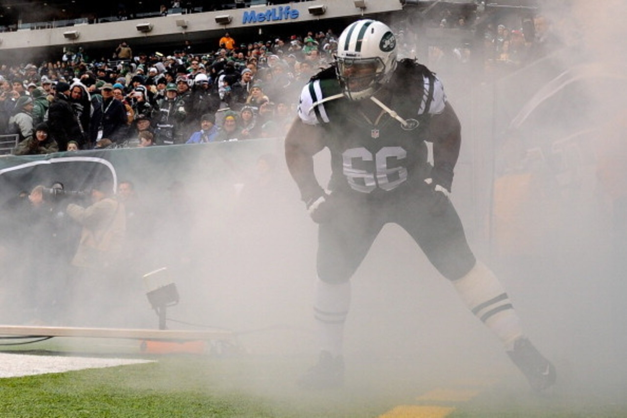 EAST RUTHERFORD, NJ - DECEMBER 08:  Willie Colon of the New York Jets enters the field before the game against the Oakland Raiders at MetLife Stadium on December 8, 2013 in East Rutherford, New Jersey. The Jets defeat the Raiders 37-27.  (Photo by Maddie 